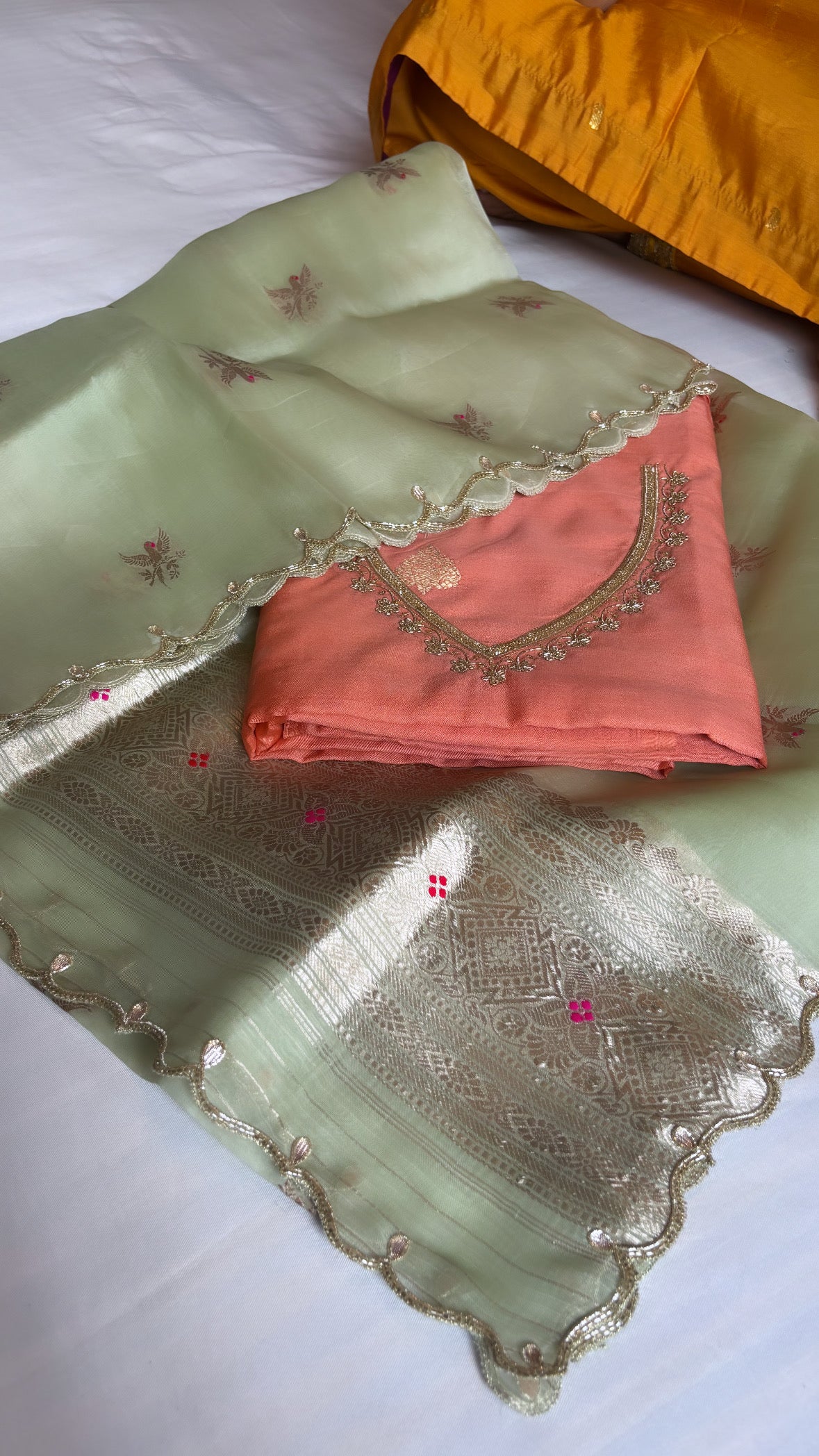 Coral orange-green kadhwa hand embroidered suit set from vyaah wala ghar edit