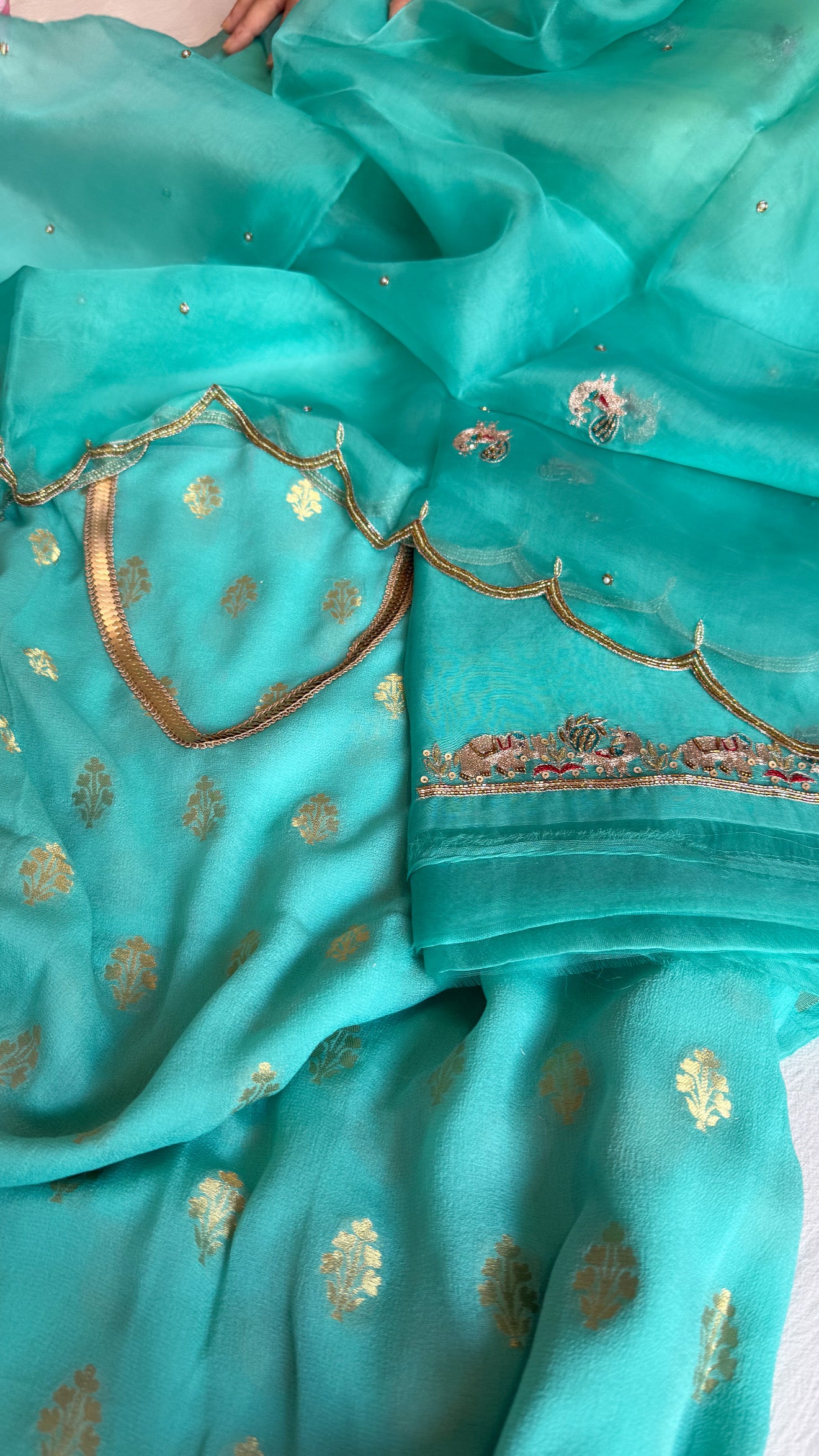 Rama blue banarasi gorgette kadhwa buti kurta paired with toy hathi motif hand embroidered scalloped duppata