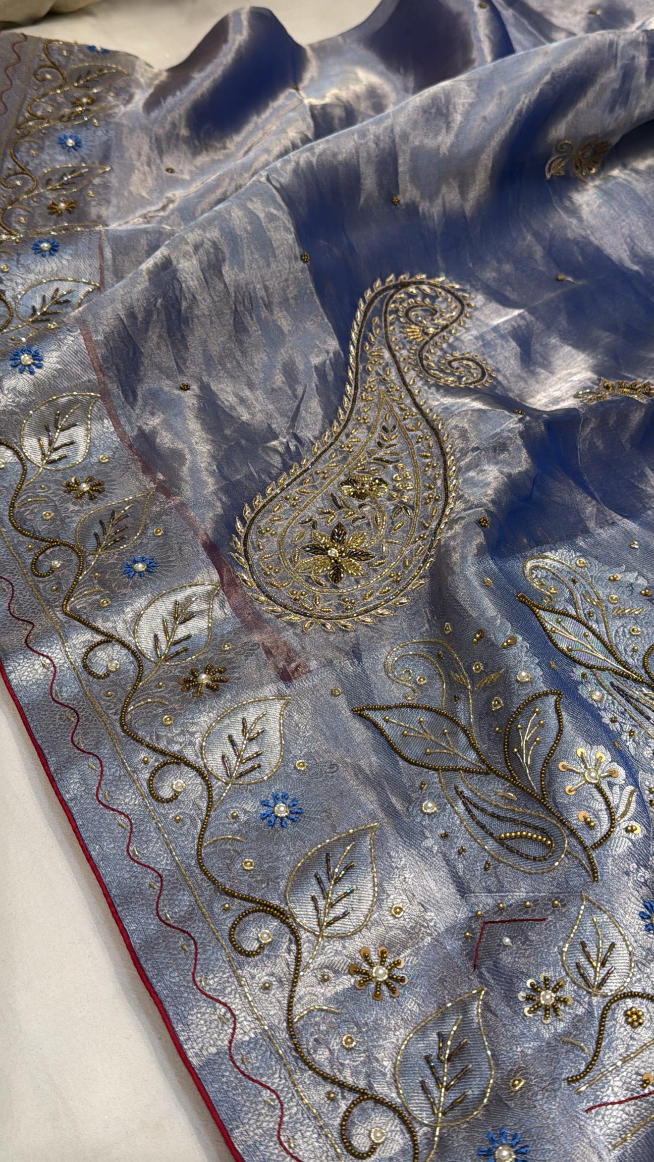 Persian blue husn tissue silk carry motif hand embroidered saree