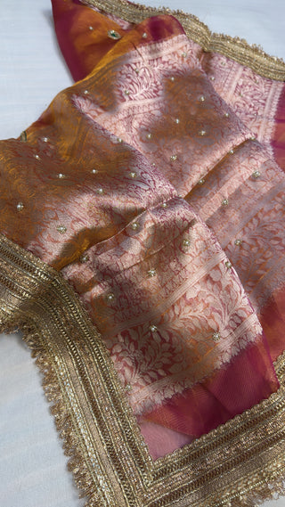 Husn pinkish-orange dhup chao effect tissue silk hand embroidered saree