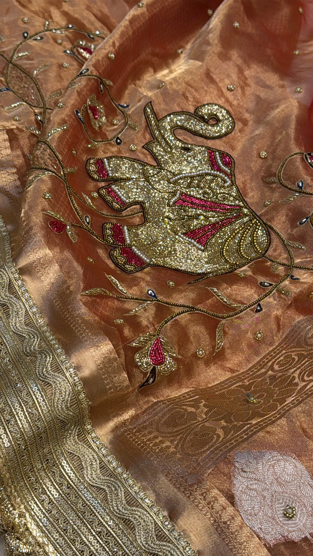 Narangi shade tissue silk dhup chao effect husn hand embroidered kadhwa saree