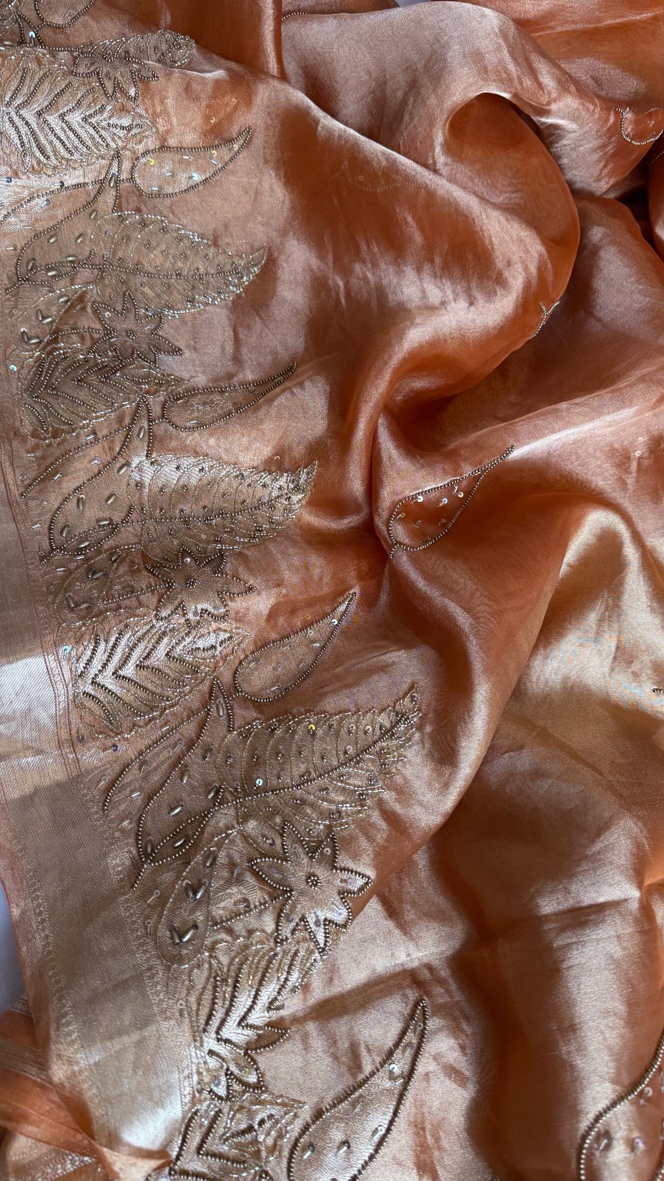 Husn tangerine red tissue silk heavy hand embroidered saree