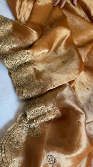 Husn peachy orange tissue silk heavy zardozi hand embroidered saree