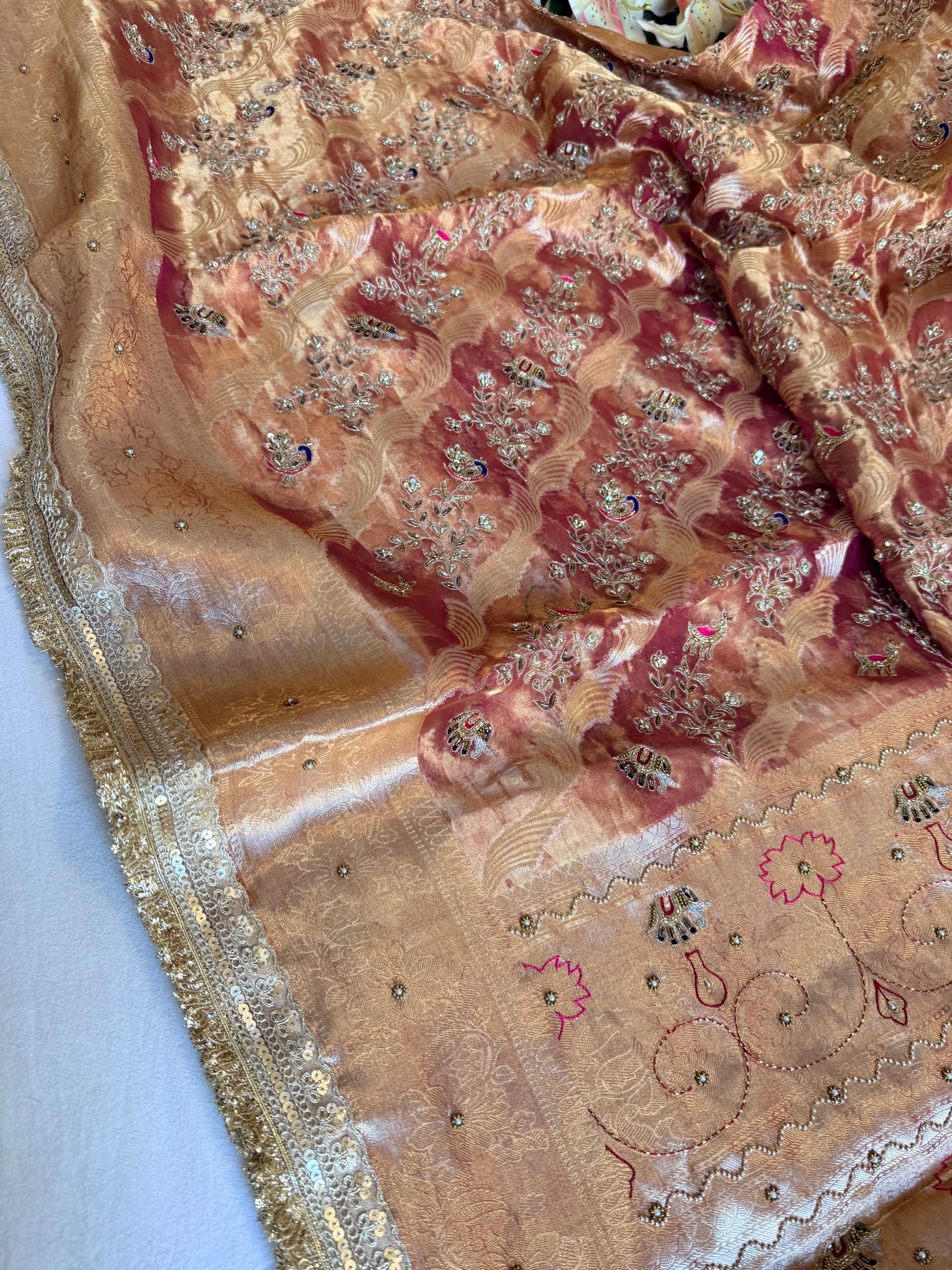 Rustic red tissue silk shikargah motif hand embroidered saree