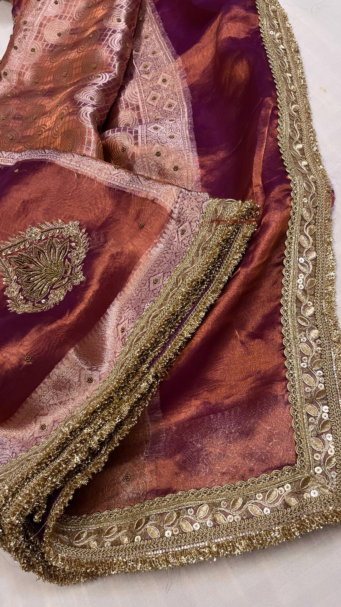 Husn copperish purple tissue silk hand embroidered saree