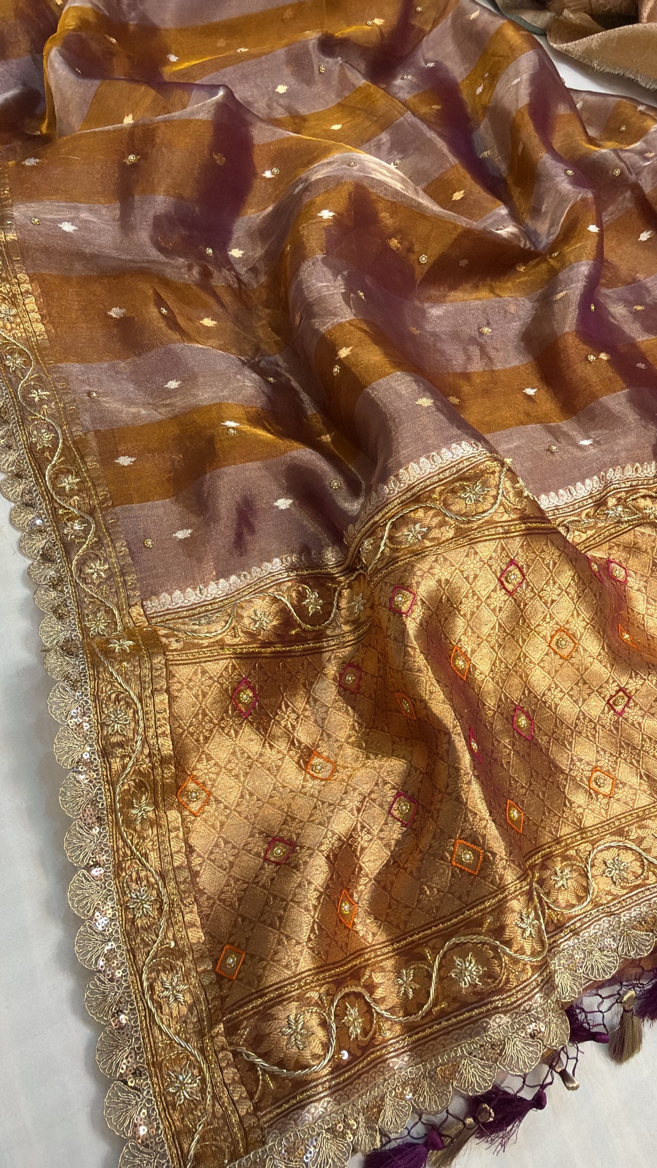 Kanjivaram peach tissue silk striped hand embroidered kadhwa saree