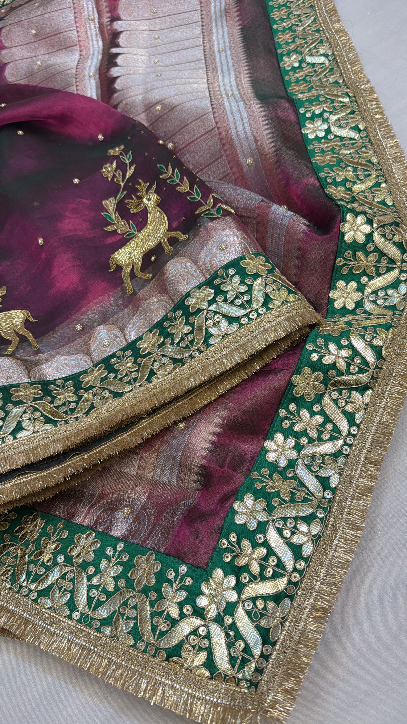 Husn cranberry pink tissue silk deer motif hand embroidered saree