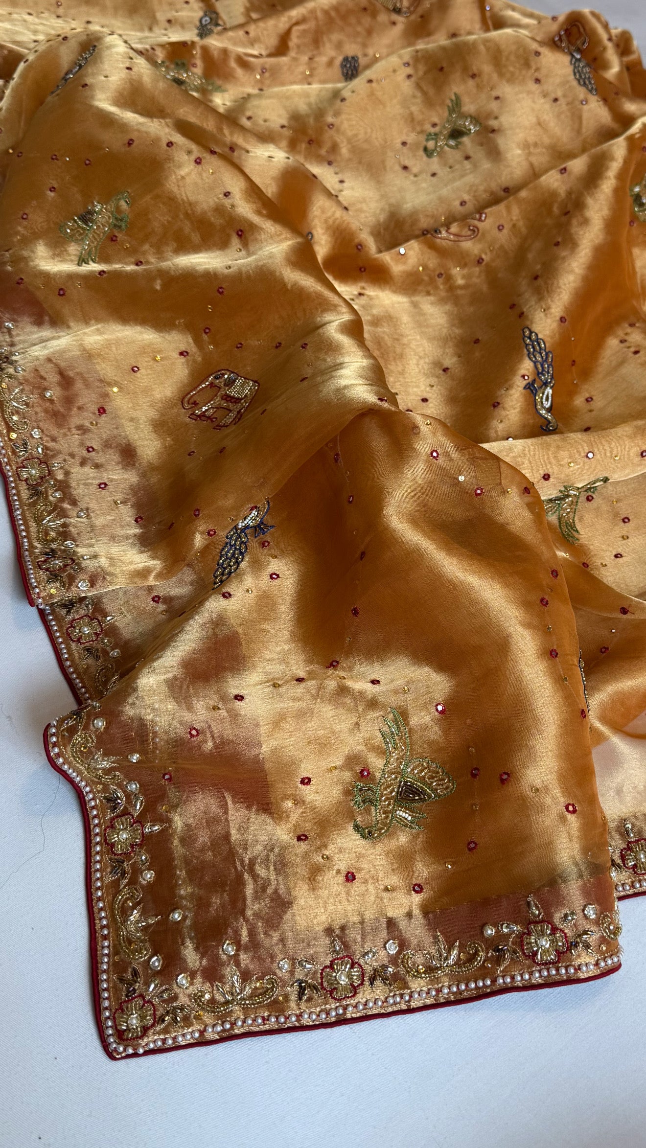 Shikarbagh edit spicy tangerine orange diamond tissue silk hand embroidered kadhwa saree