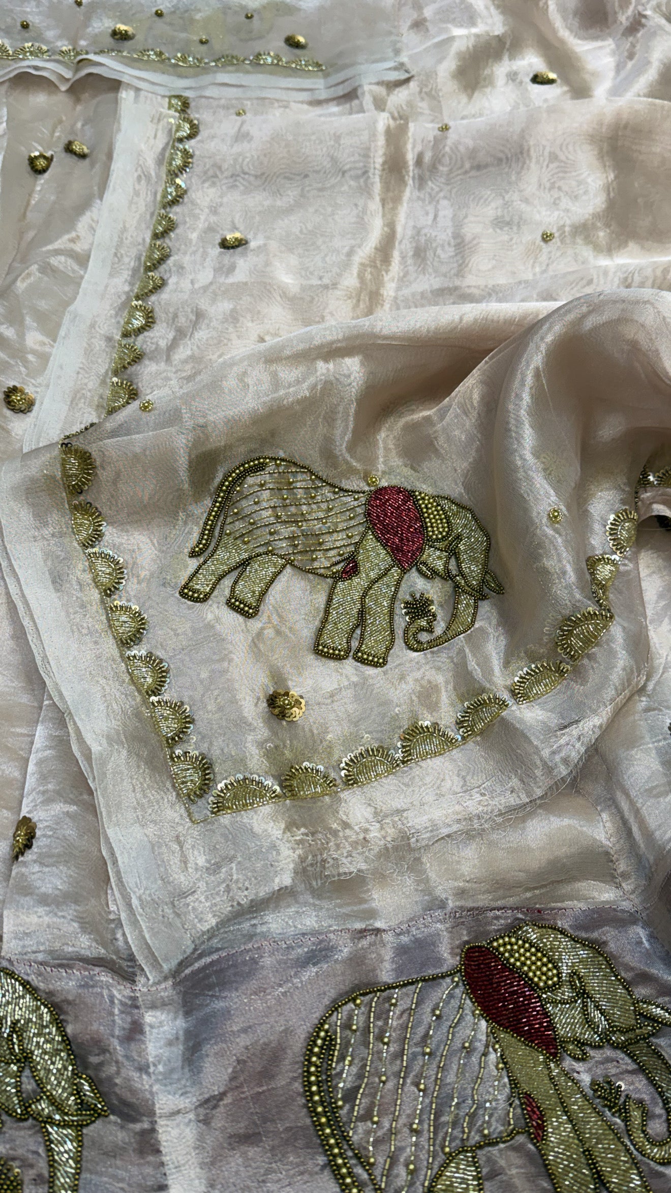 Gajgamini diamond tissue silk light rose gold zari elephant motif hand embroidered lehenga sets