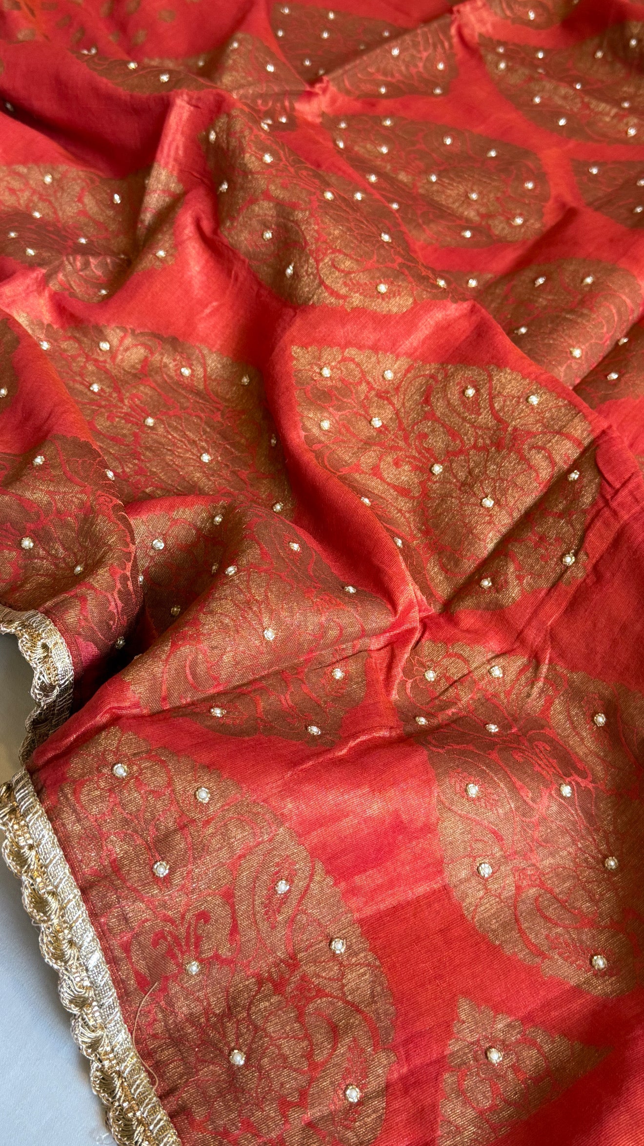 Chilly red tissue gorgette kadhwa antique zari hand embroidered saree