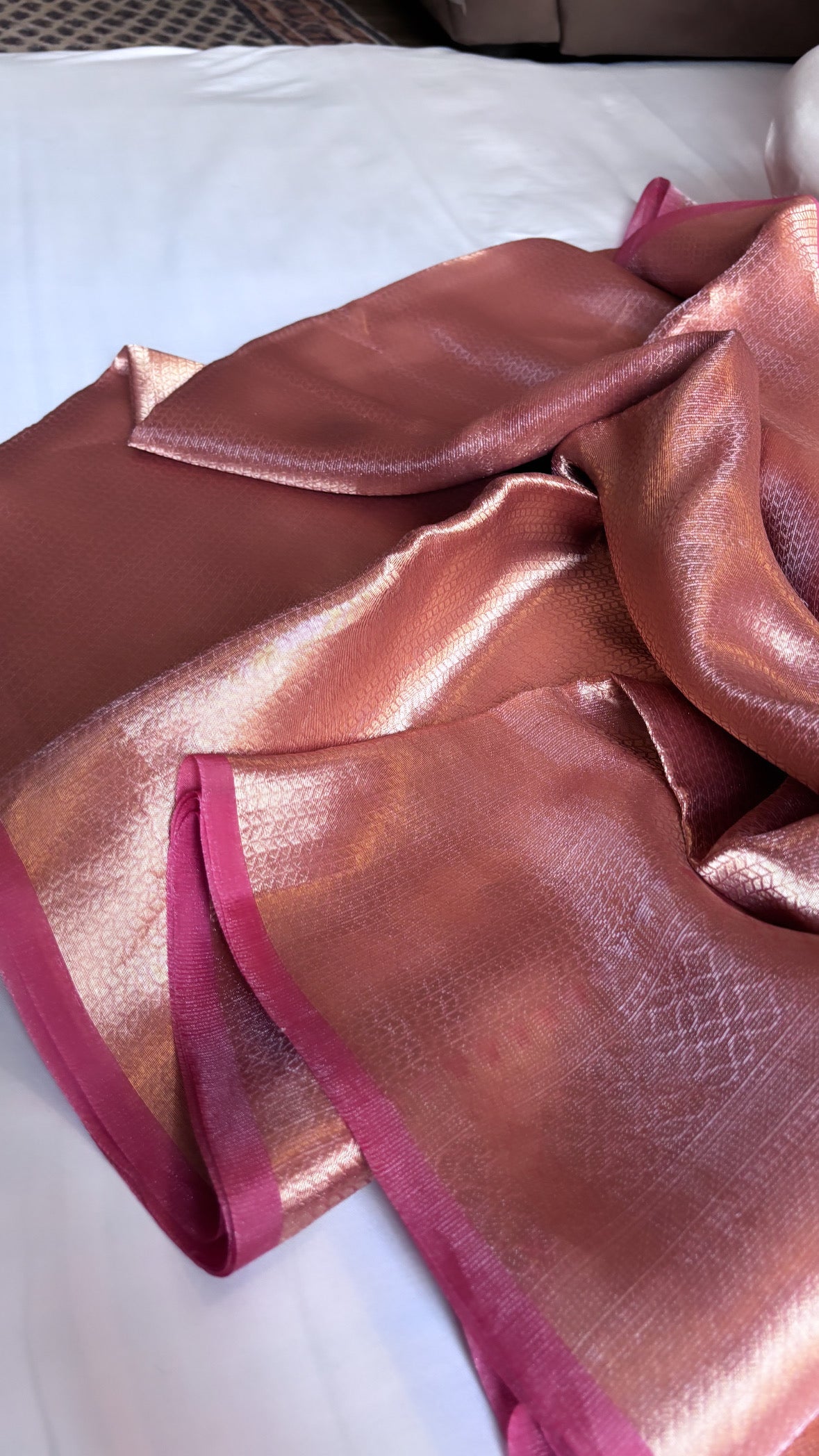 Pinkish-orange dhup-chao effect tissue brocade kadhwa saree