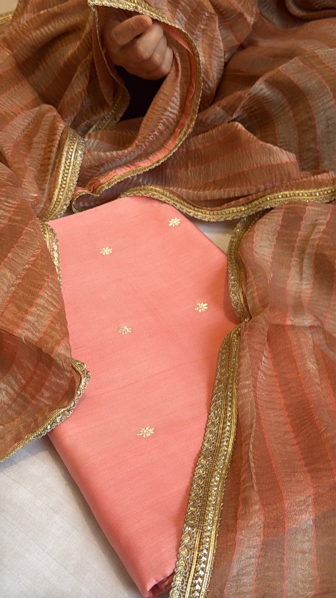 Peachy shade cotton handloom kurta paired with crushed tissue silk striped duppata set