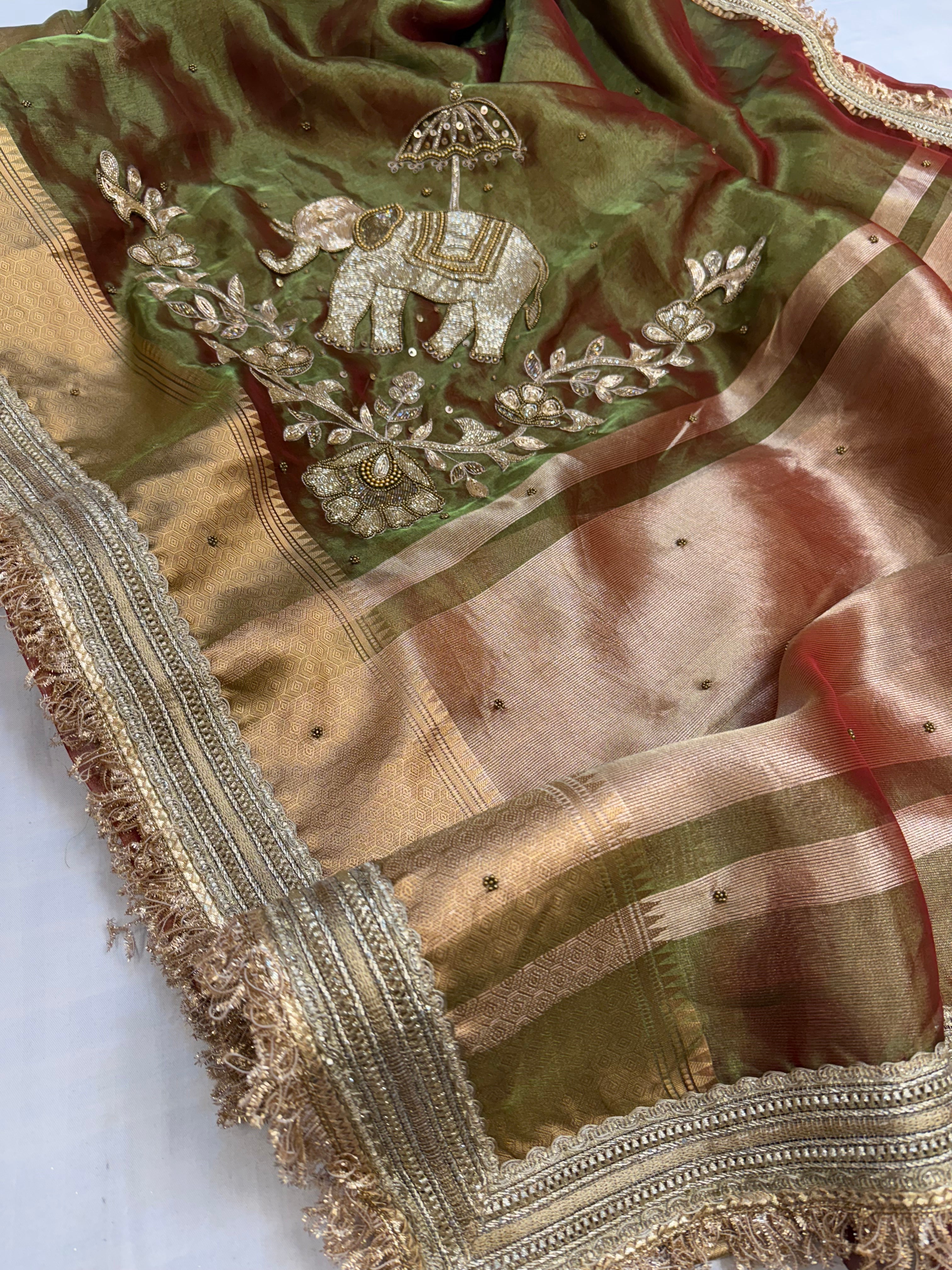 Dulhan ki maa wali sarees - Mehendi green elephant motif hand embroidered tissue saree