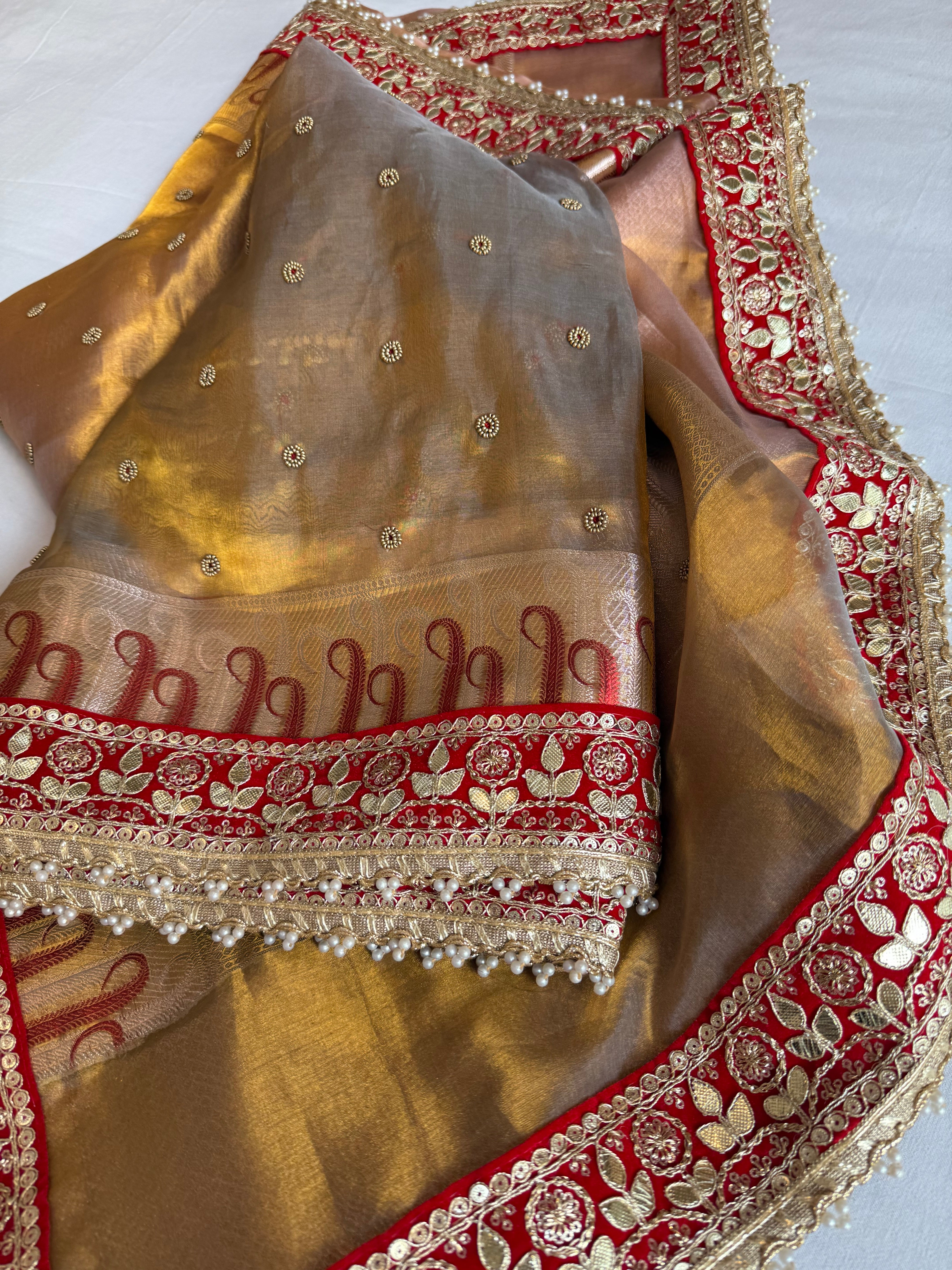Kanjivaram gold tissue silk red meenakari hand embroidered kadhwa saree