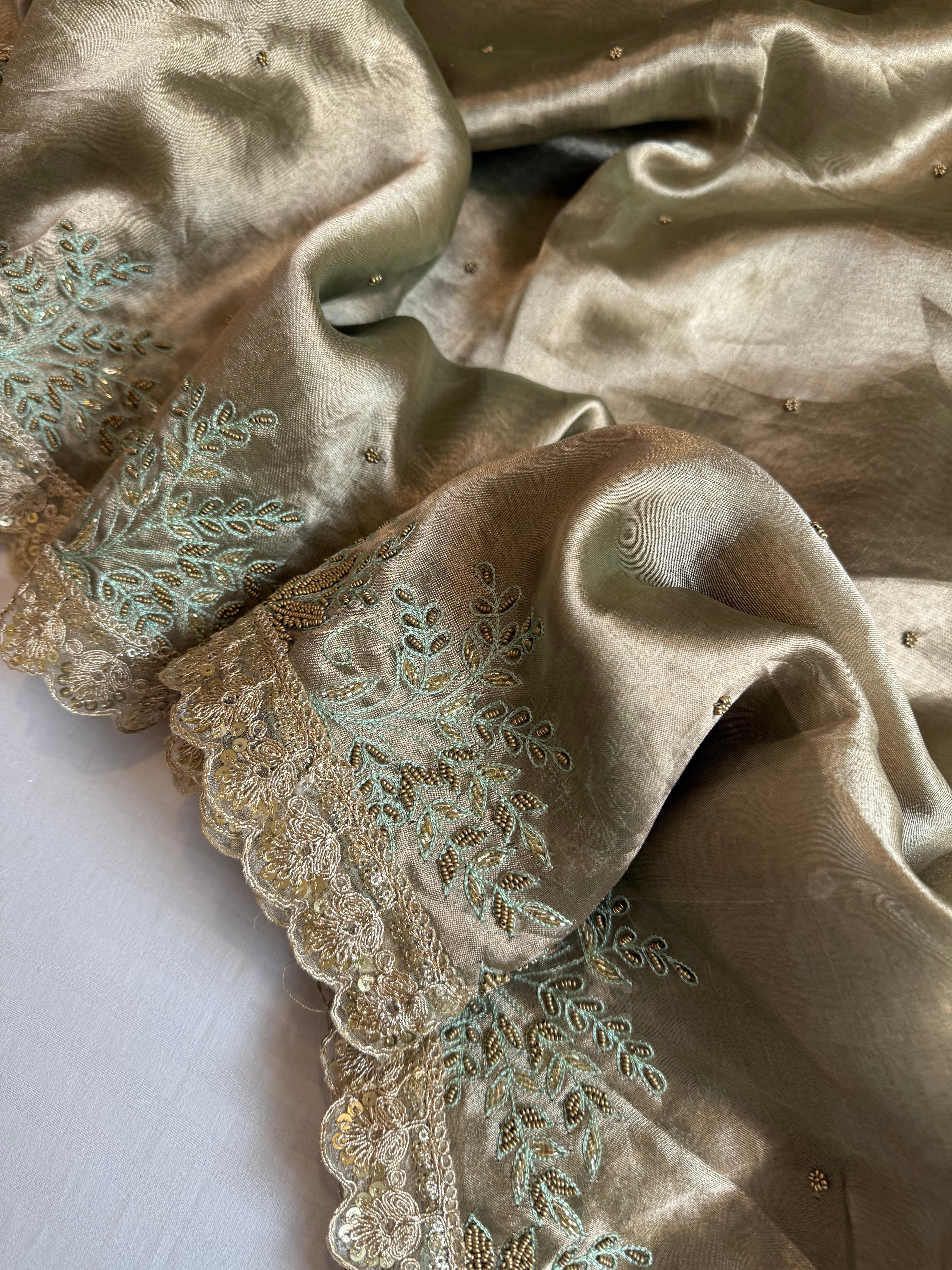 Husn tissue silk sage green heavy zardozi hand embroidered saree