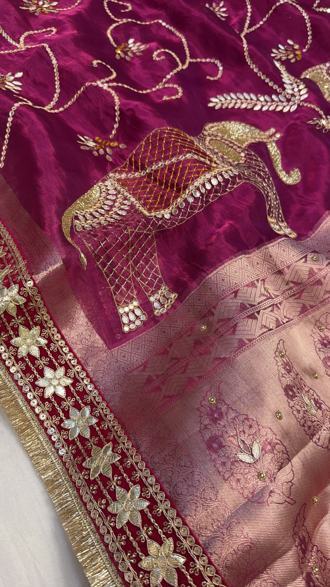 Rani pink husn tissue silk elephant motif hand embroidered saree