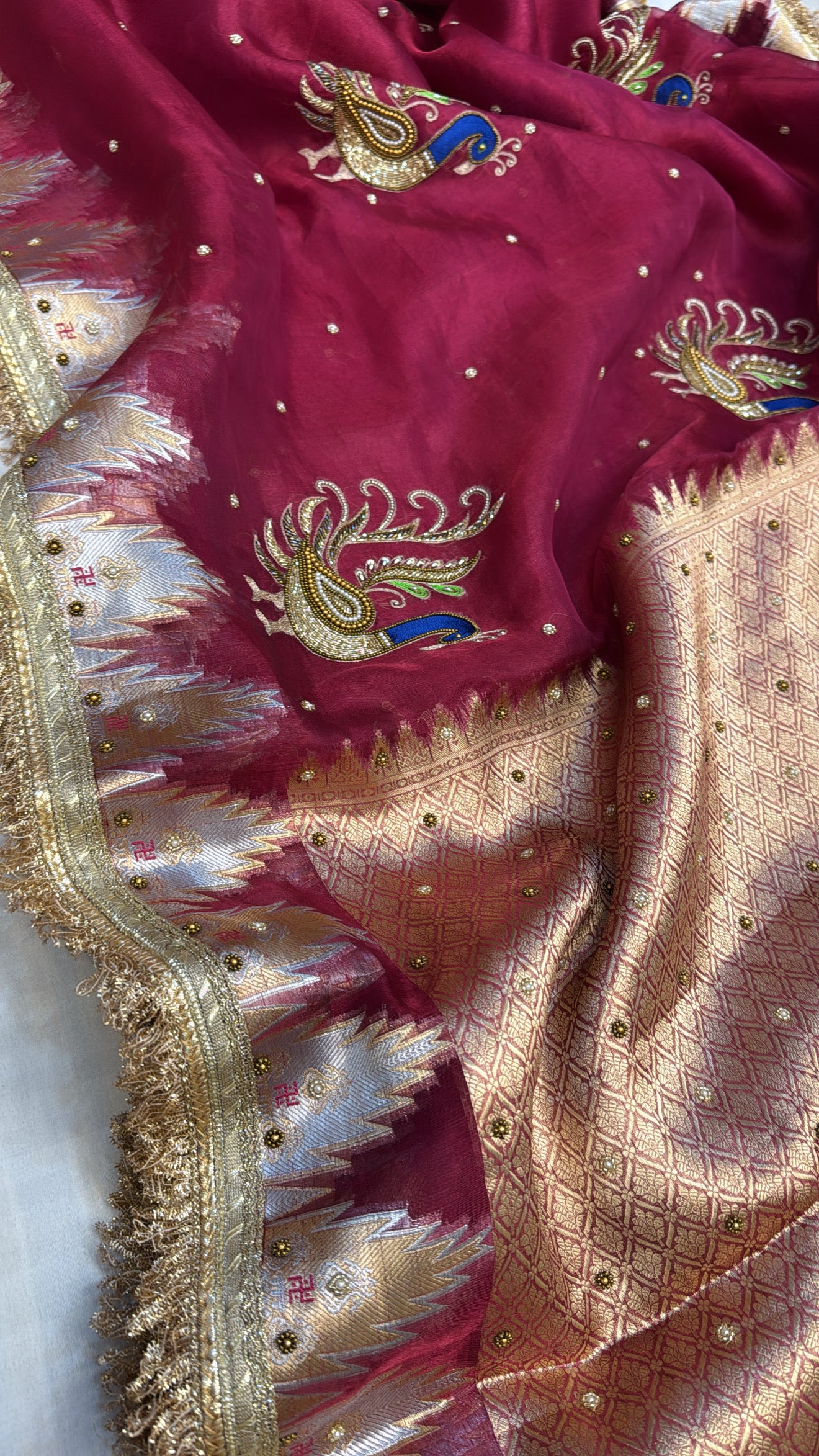 Cranberry red tissue silk kadhwa hand embroidered saree