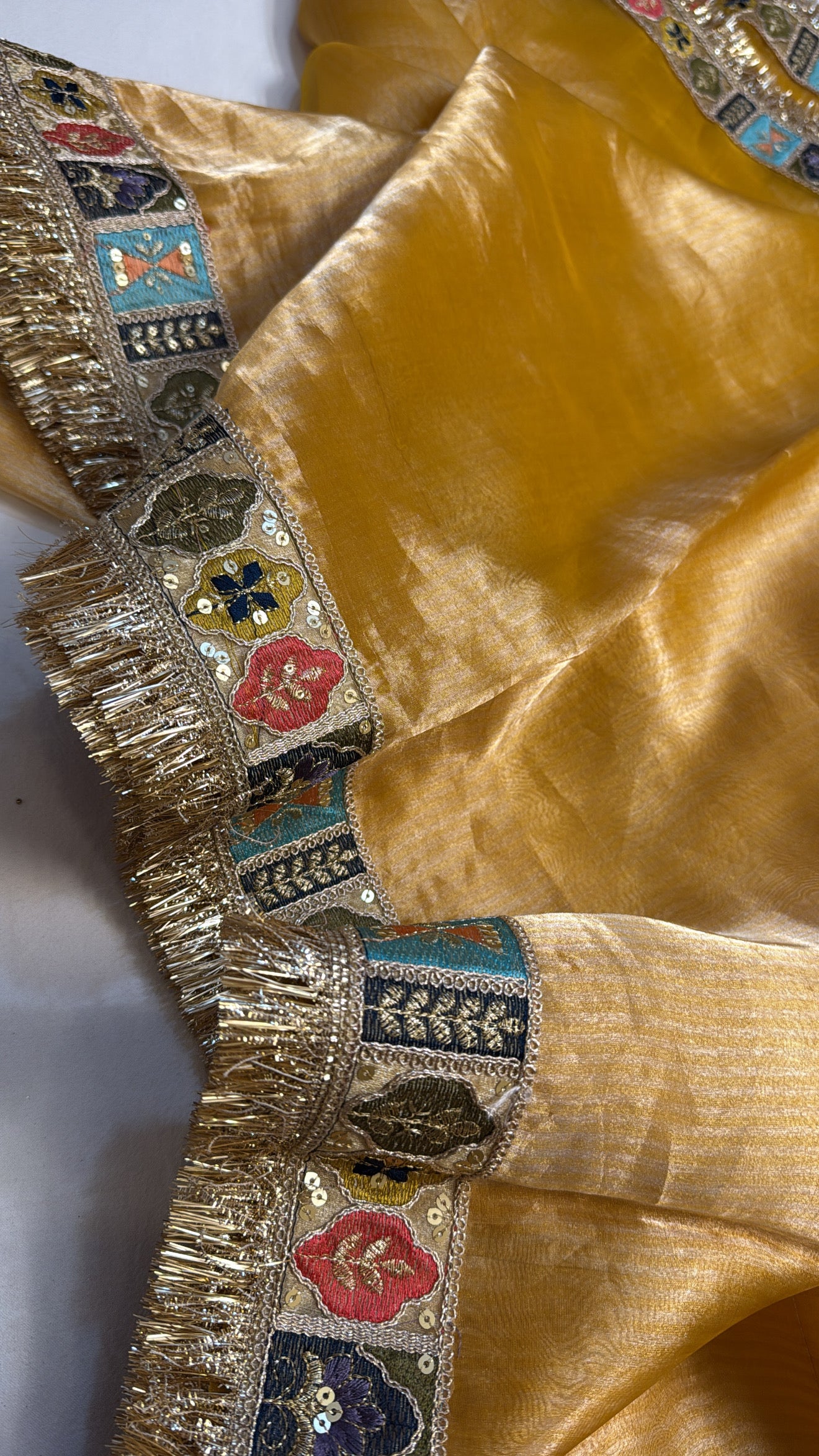 Haldi yellow tissue silk kadhwa meenakari border saree