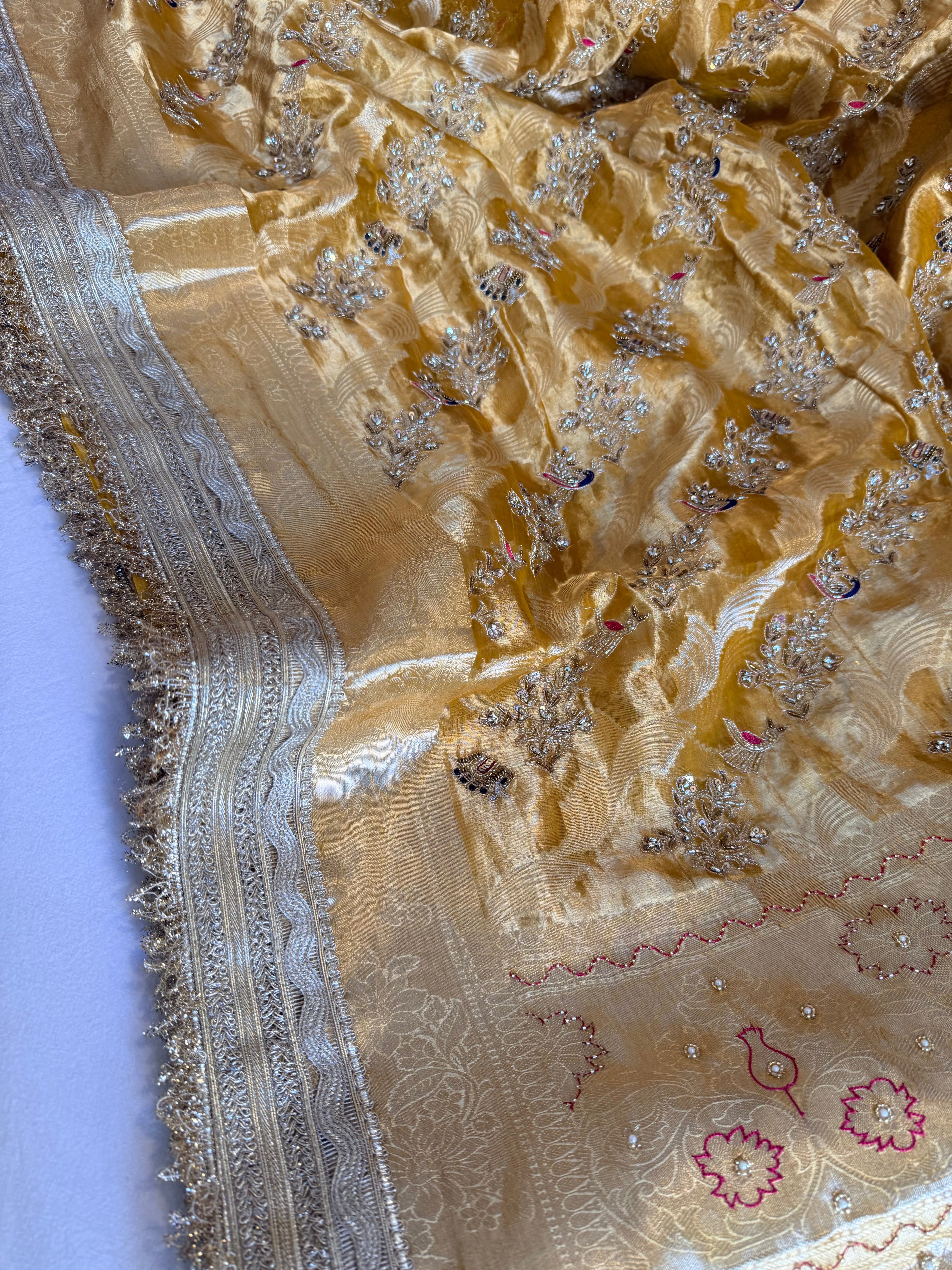 Haldi yellow tissue silk shikargah motif hand embroidered kadhwa saree