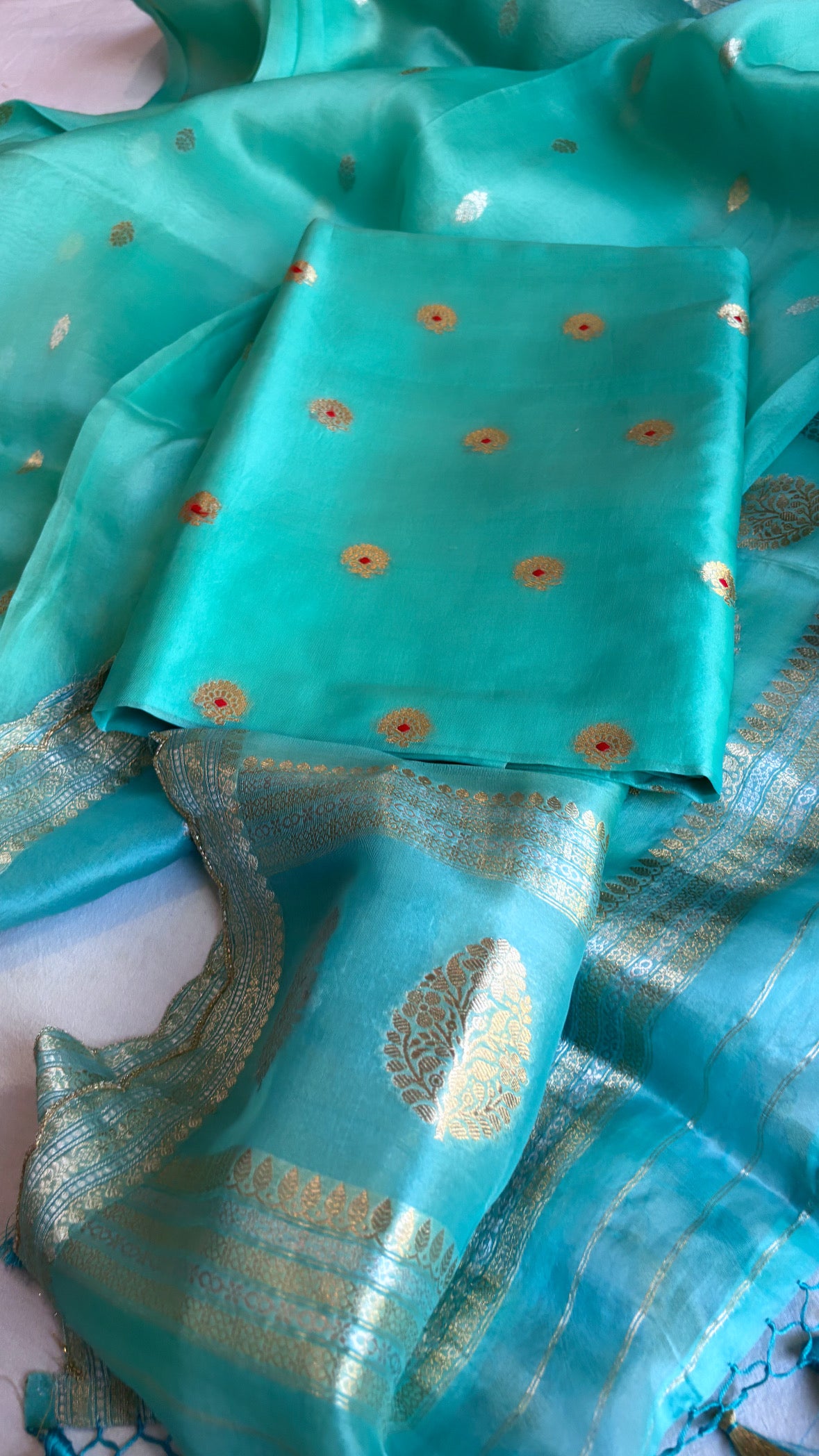 Banarasi firozi blue kora silk hand embroidered scalloped suit sets