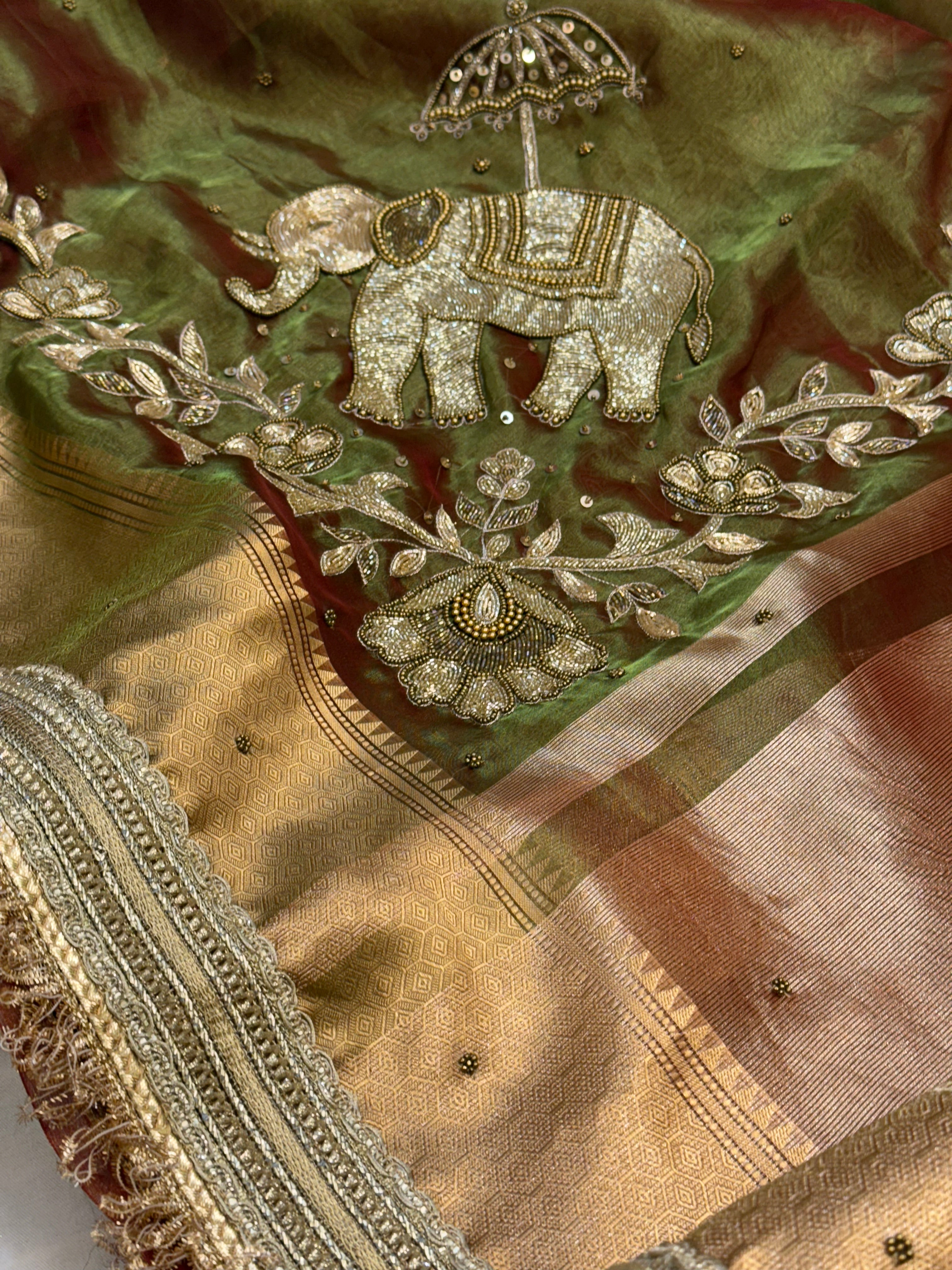 Dulhan ki maa wali sarees - Mehendi green elephant motif hand embroidered tissue saree