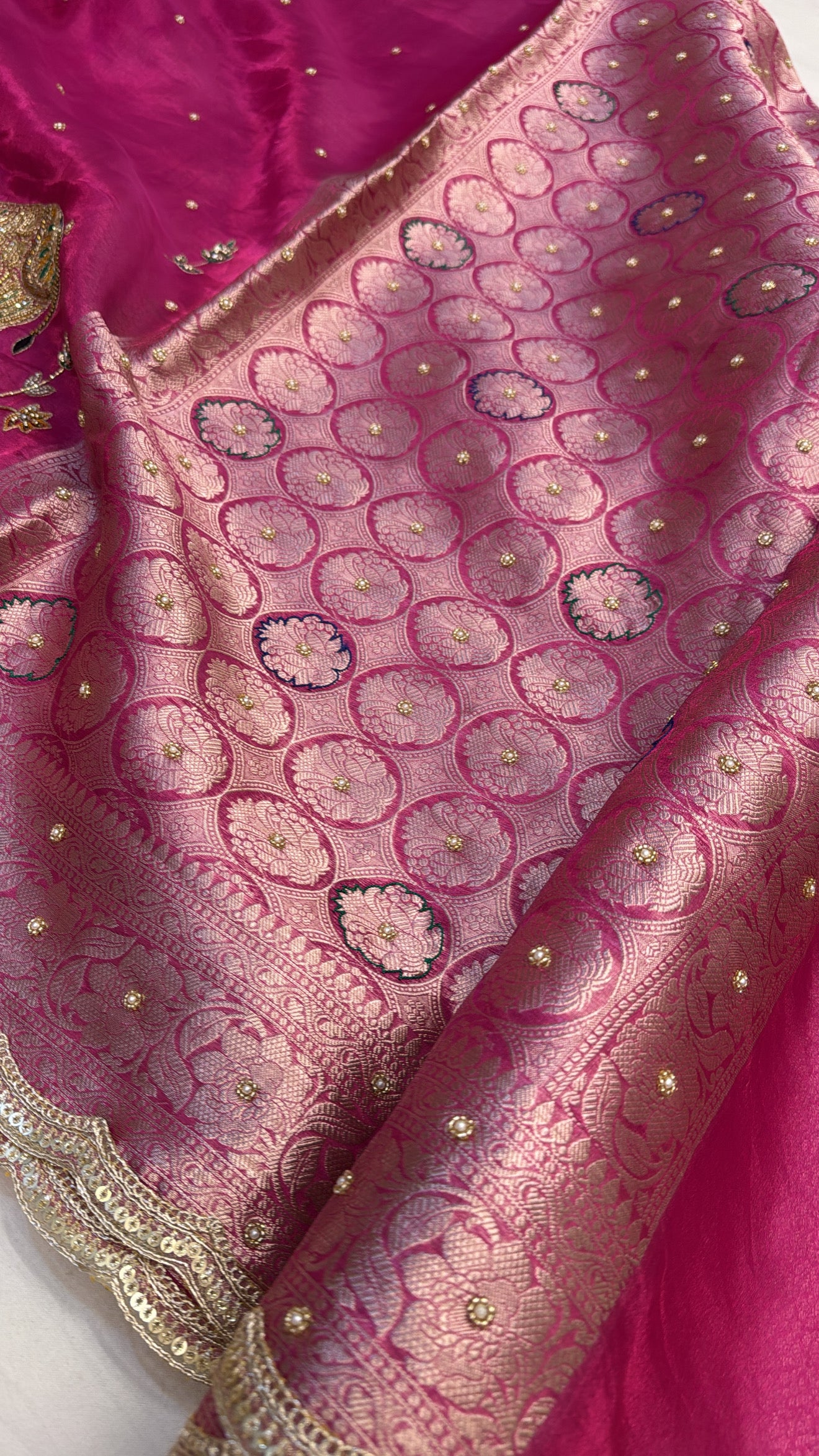 Rani pink husn tissue silk elephant motif hand embroidered saree
