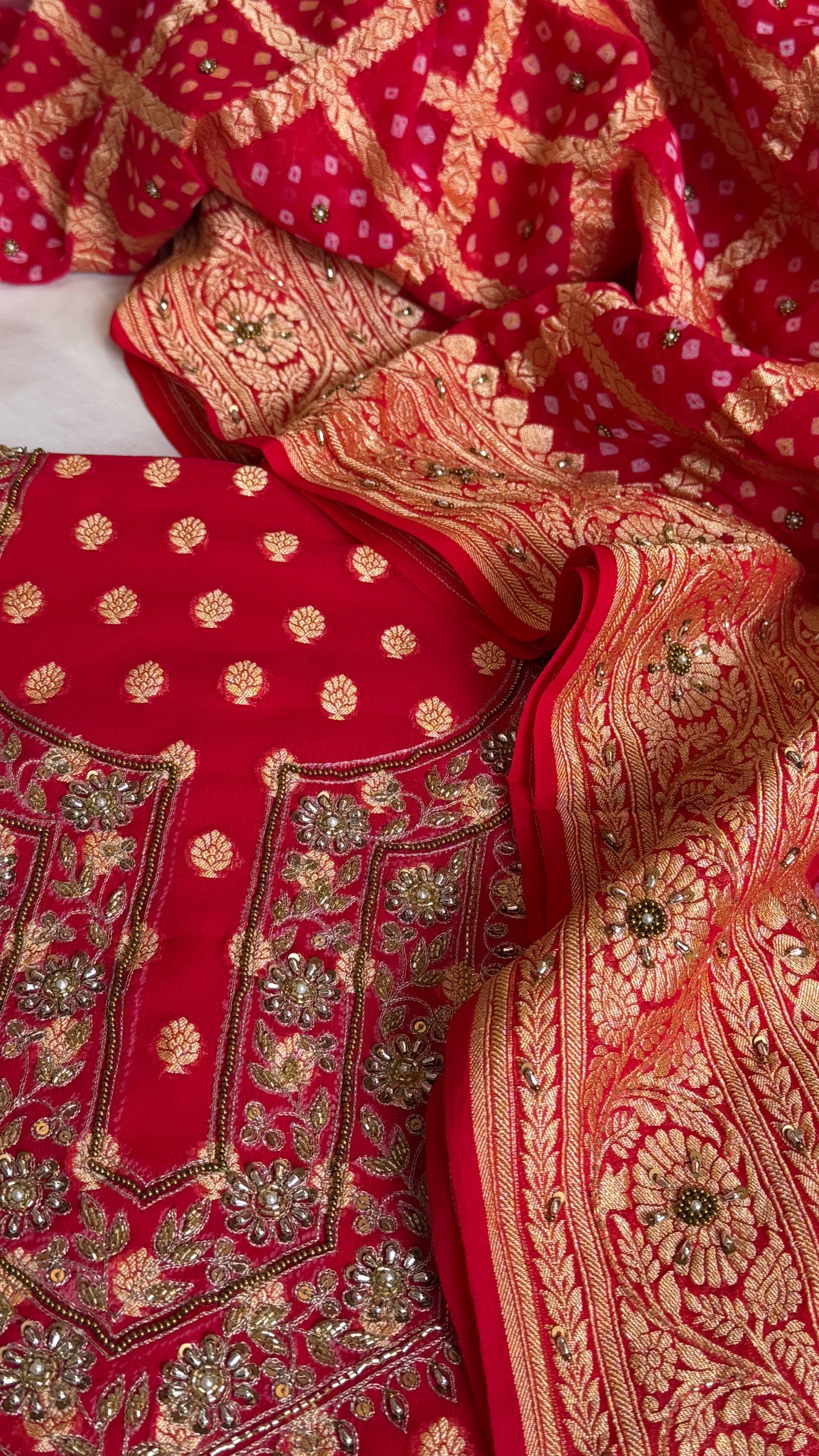 Red rai bandhej kadhwa gorgette hand embroidered suit set