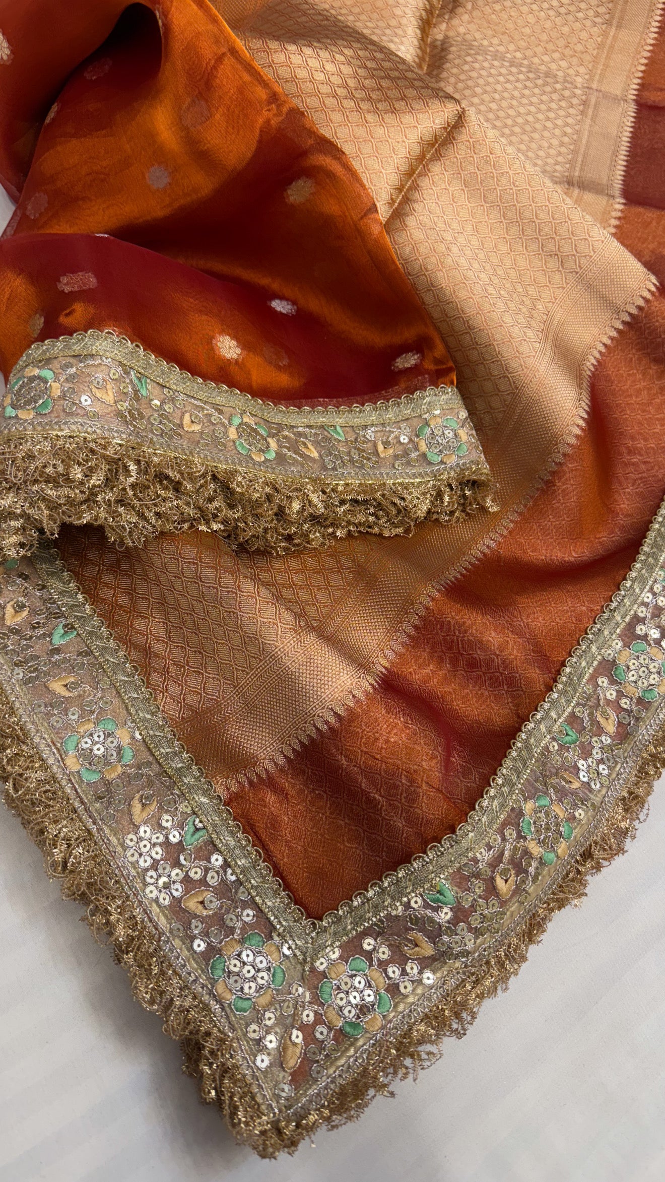 Maharani deep orange tissue silk kadhwa buti saree
