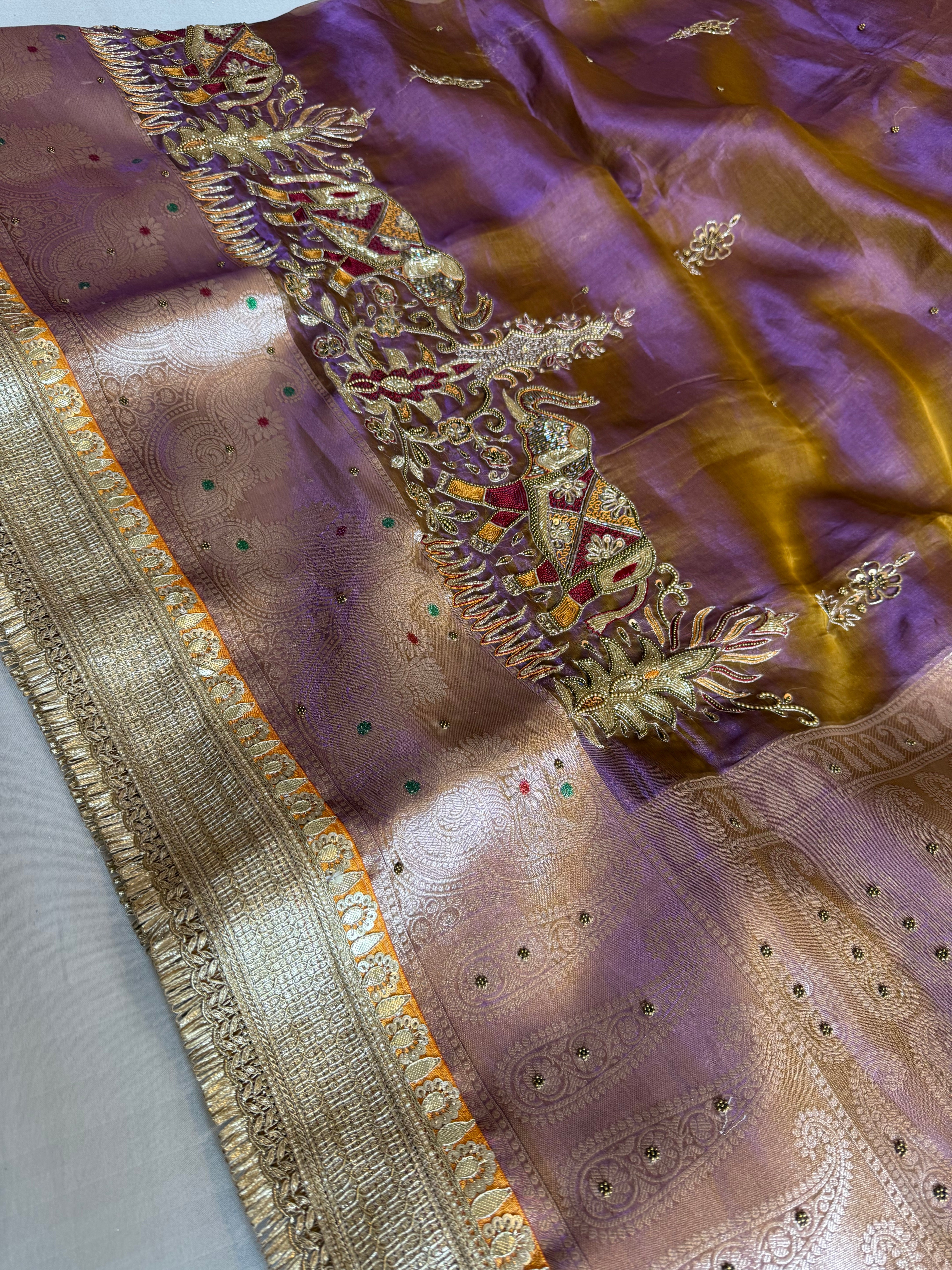 Elephant motif lavender tissue silk hand embroidered kadhwa saree