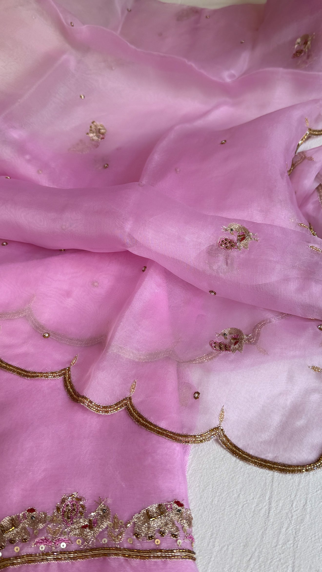 Blush pink banarasi gorgette kadhwa buti kurta paired with toy hathi motif hand embroidered scalloped kora duppata
