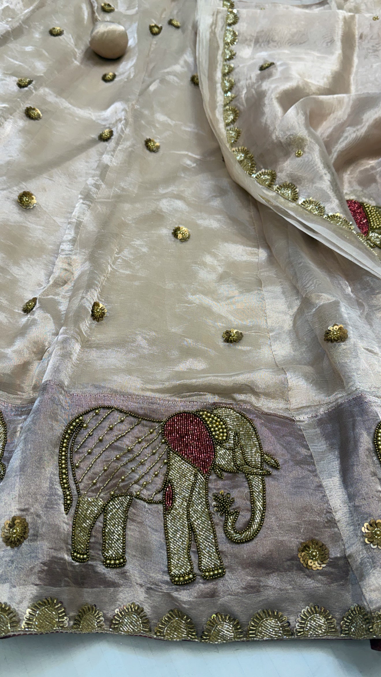 Gajgamini diamond tissue silk light rose gold zari elephant motif hand embroidered lehenga sets