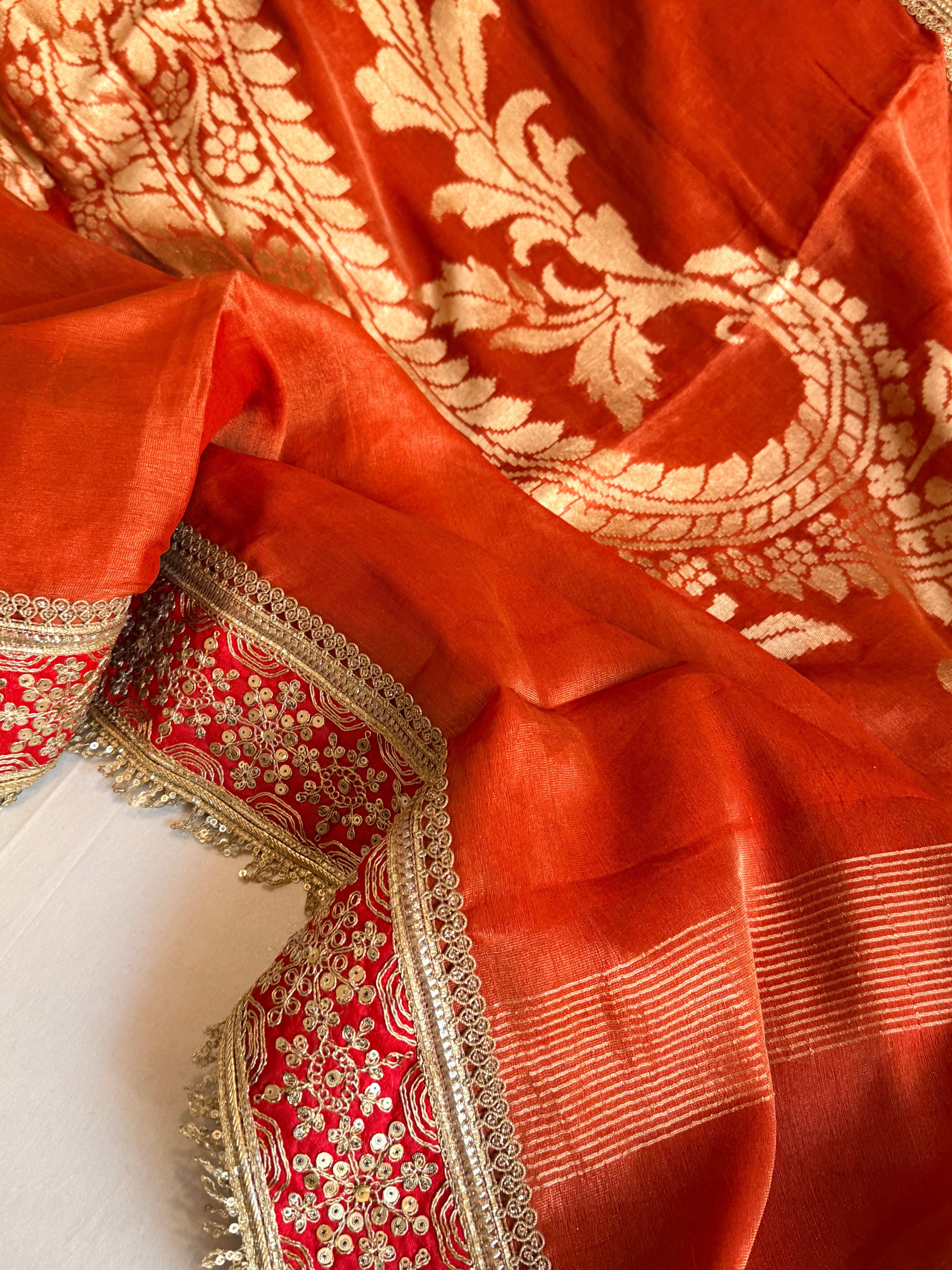 Rustic orange tissue gorgette kadhwa motif saree