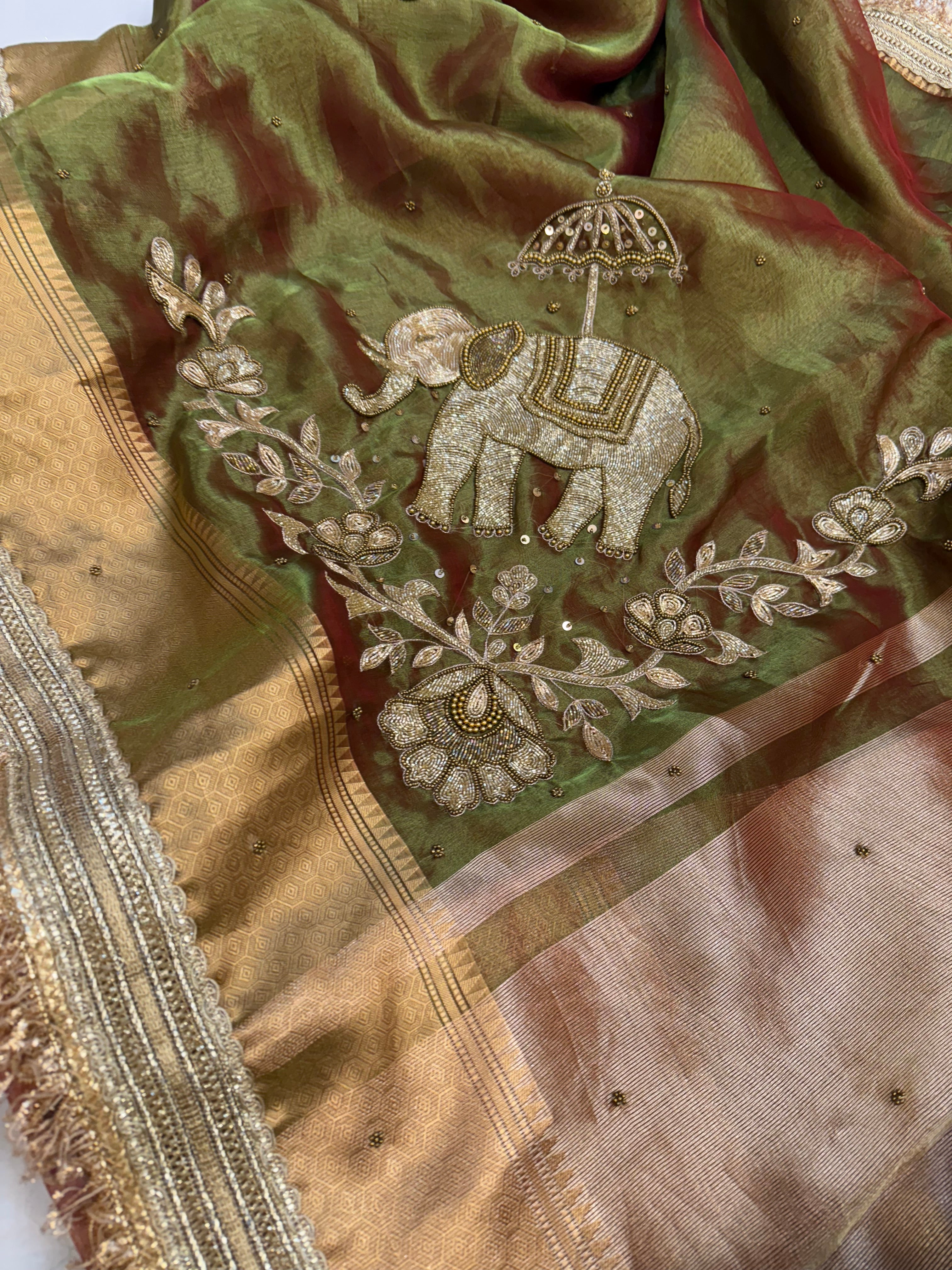 Dulhan ki maa wali sarees - Mehendi green elephant motif hand embroidered tissue saree