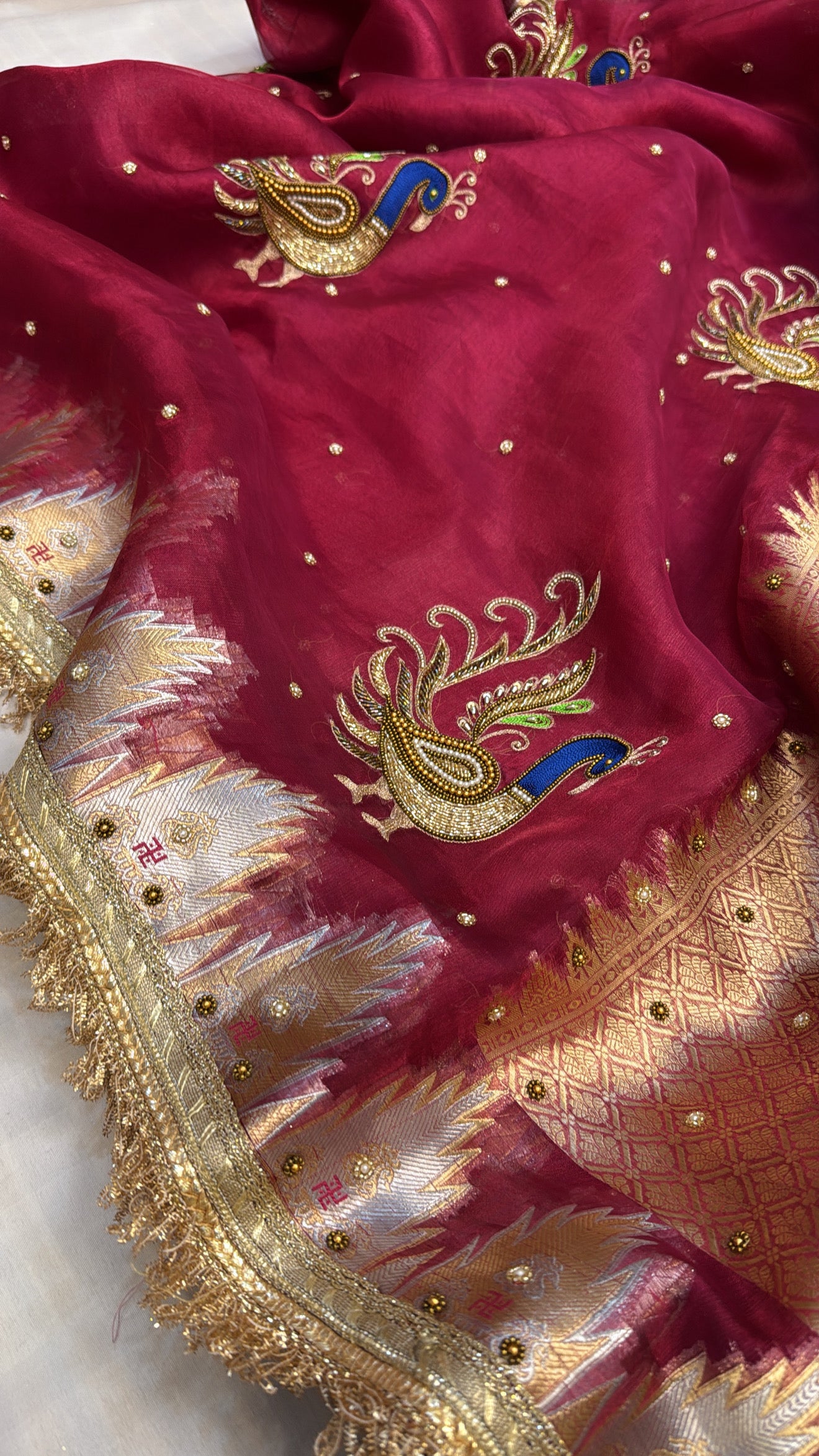 Cranberry red tissue silk kadhwa hand embroidered saree