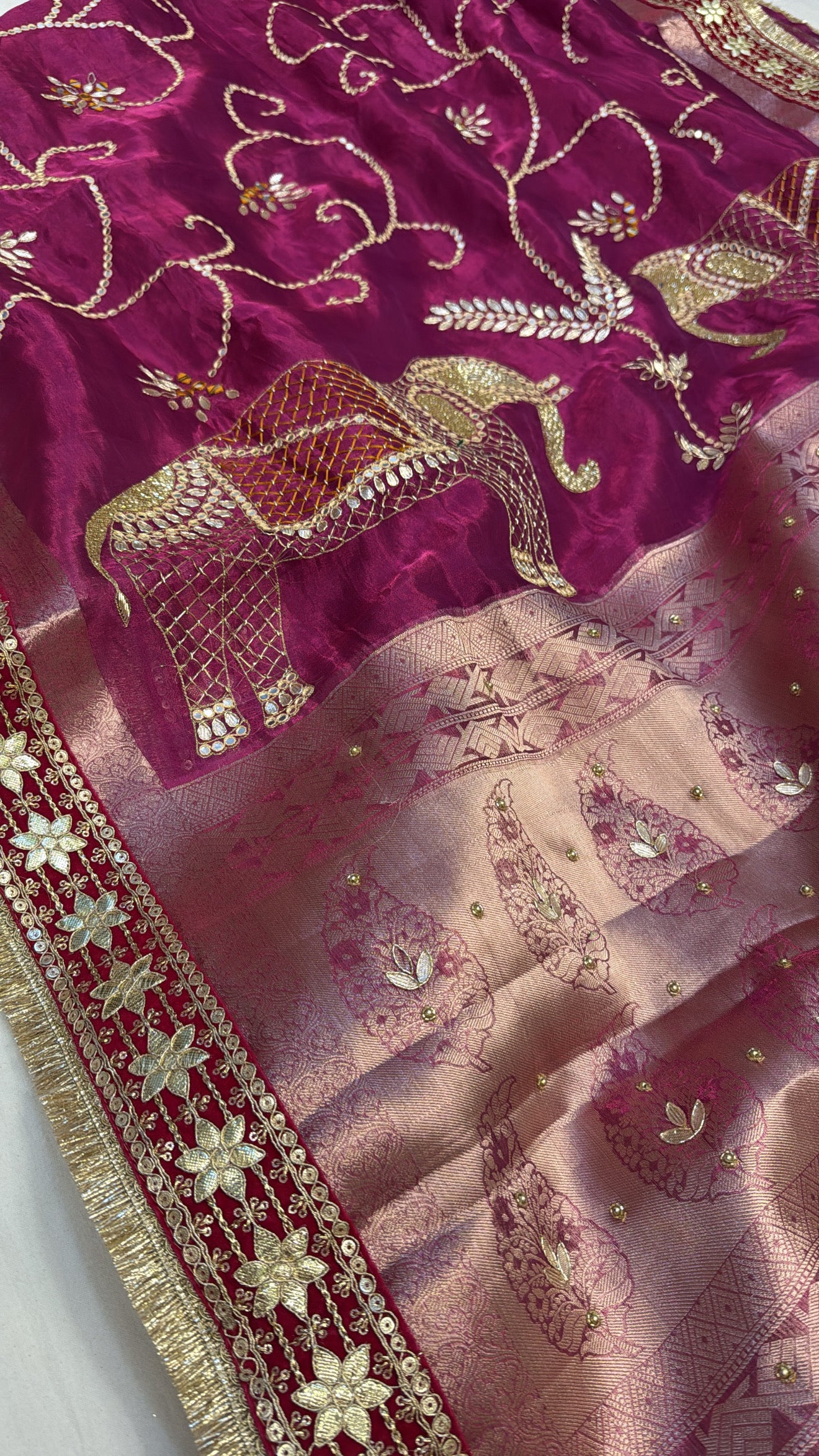 Rani pink husn tissue silk elephant motif hand embroidered saree