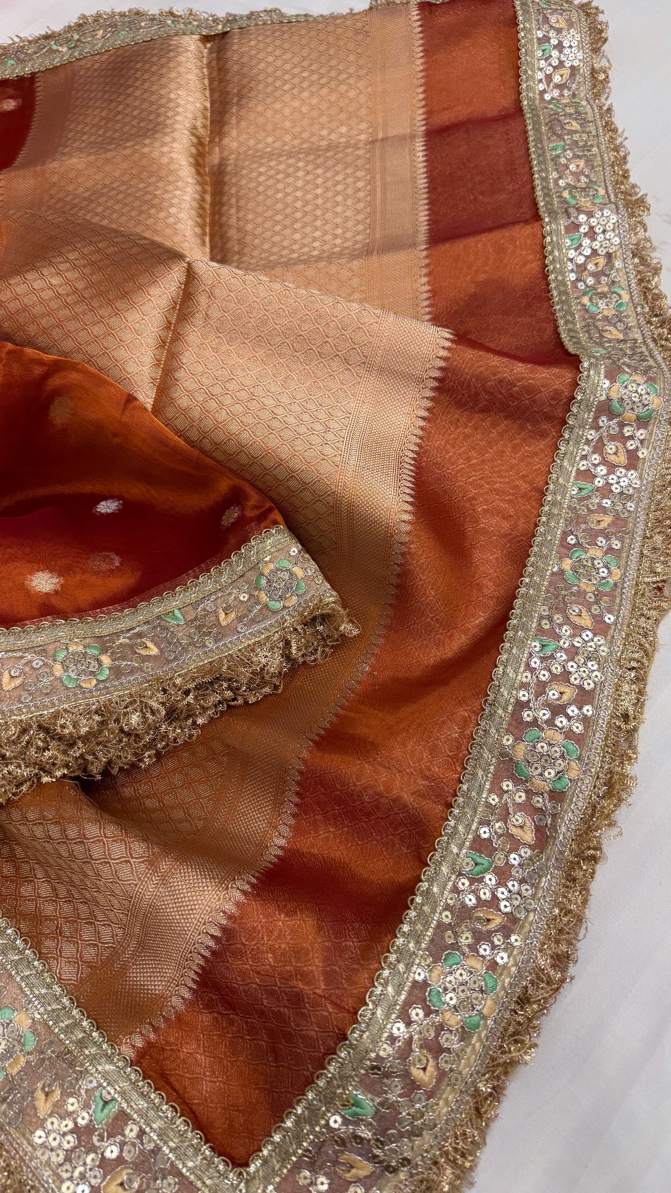 Maharani deep orange tissue silk kadhwa buti saree