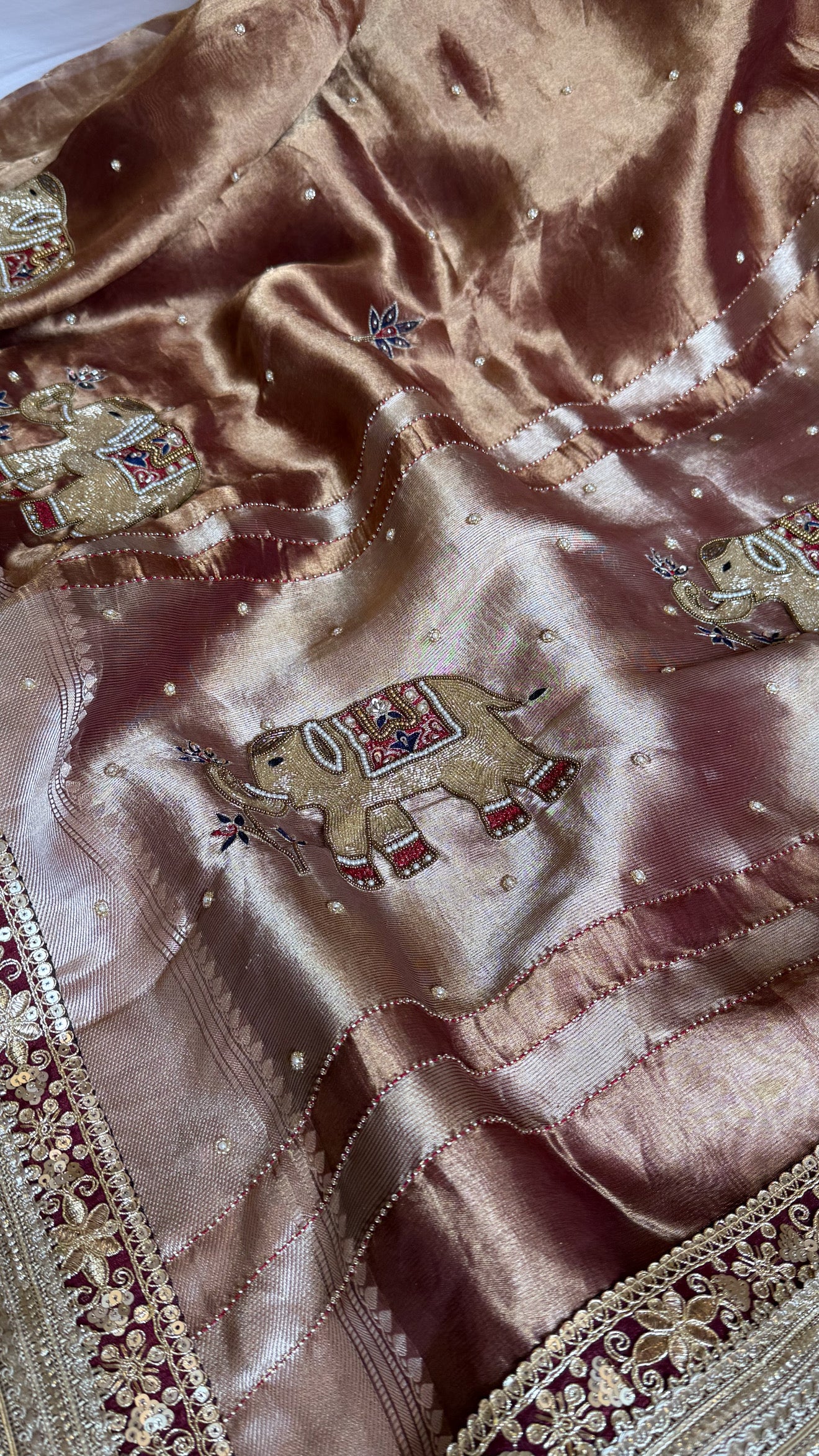 Elephant motif brown tissue silk hand embroidered husn saree
