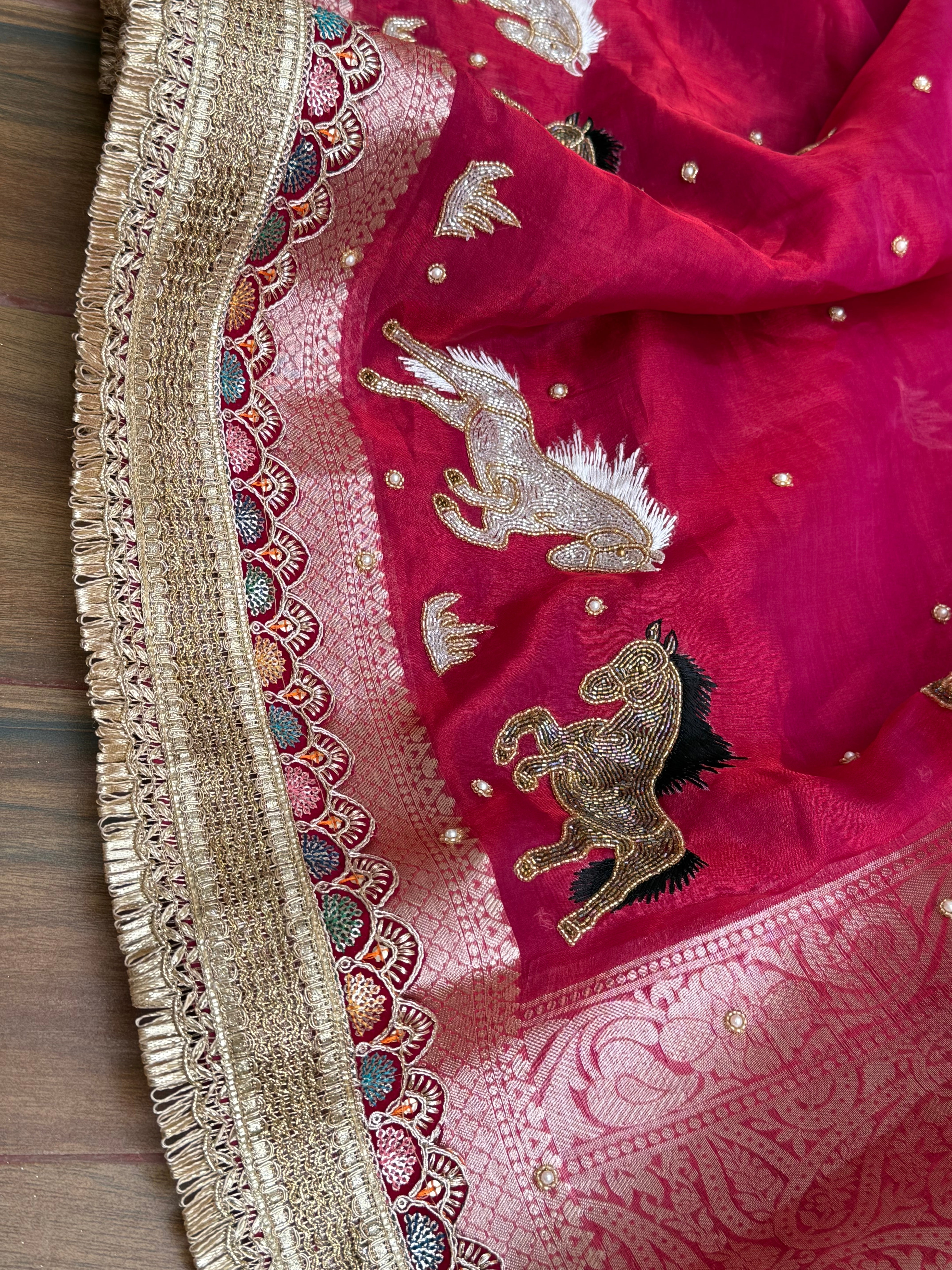 Horse hand embroidered motif cherry pinkish red dhup chao effect tissue silk banarasi gotapatti kadhwa saree