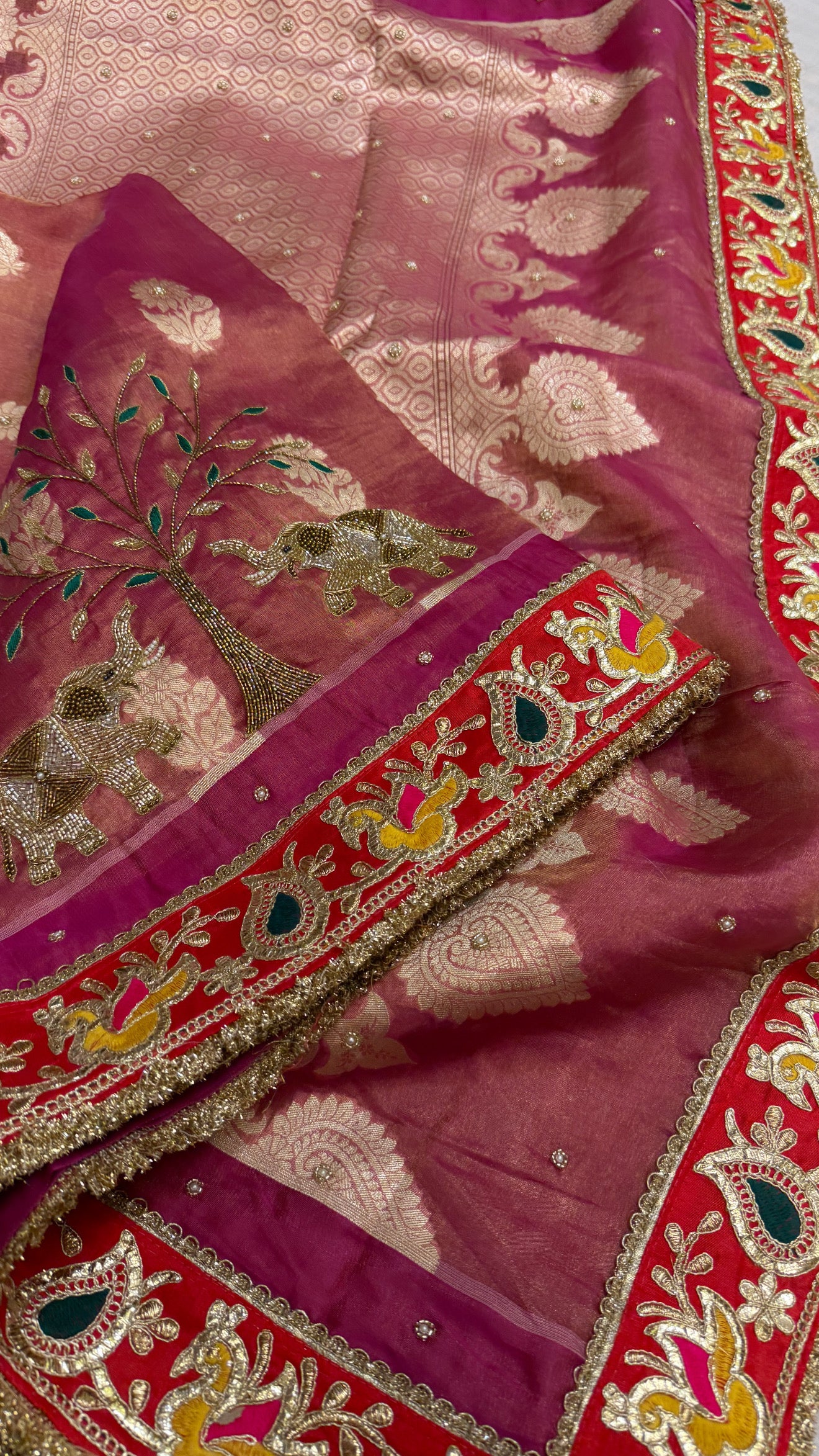 Husn shikargah edit rani pink tissue silk hand embroidered elephant motif saree