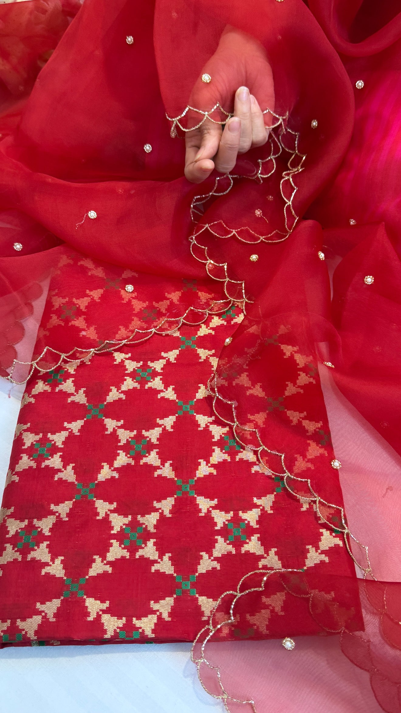 Blood red katan silk patola weaving kurta paired with kora silk scalloped duppata set