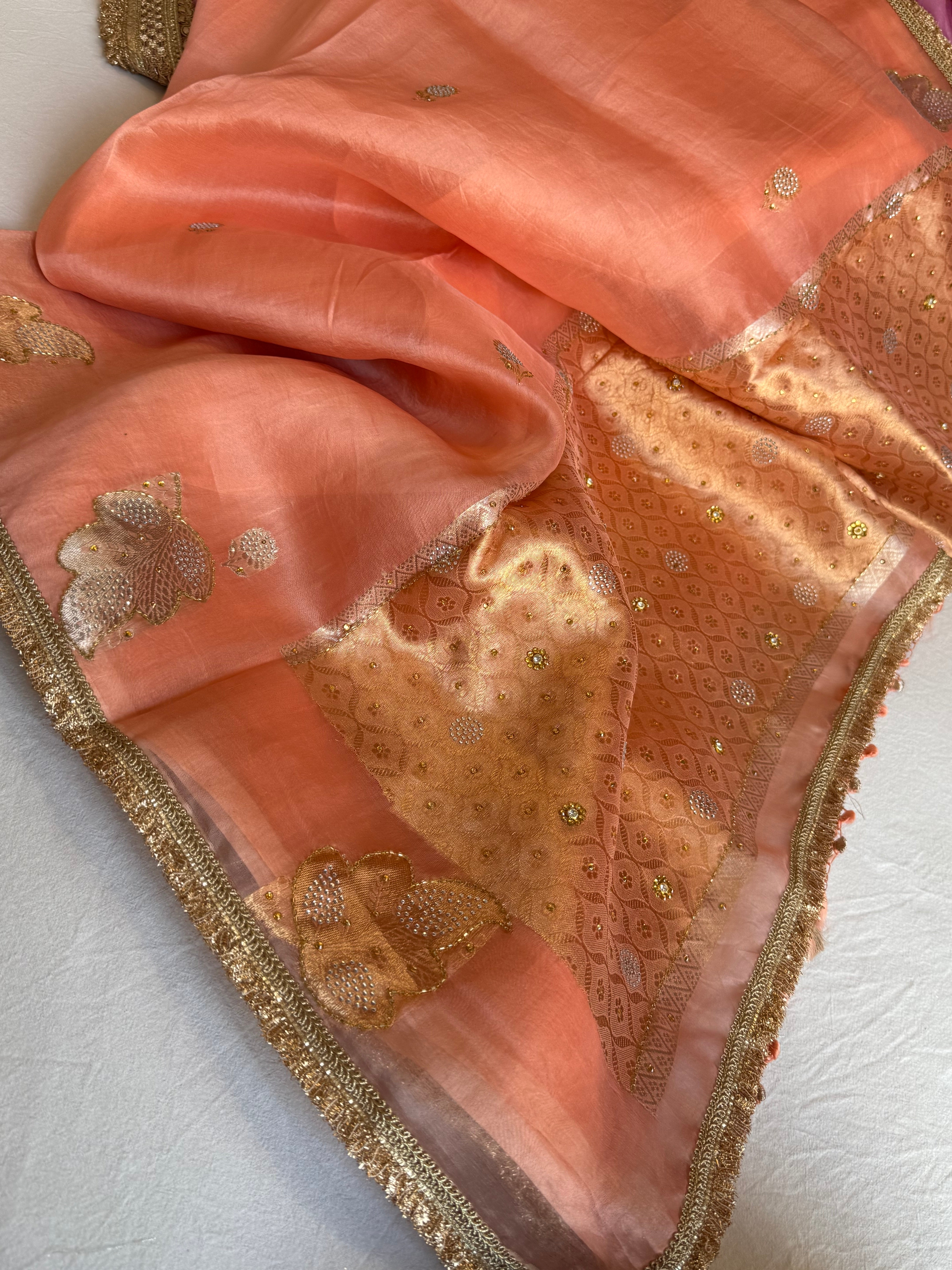 Creamy peach banarasi kora silk heavy sitara stonework kadhwa buti hand embroidered gotapatti saree
