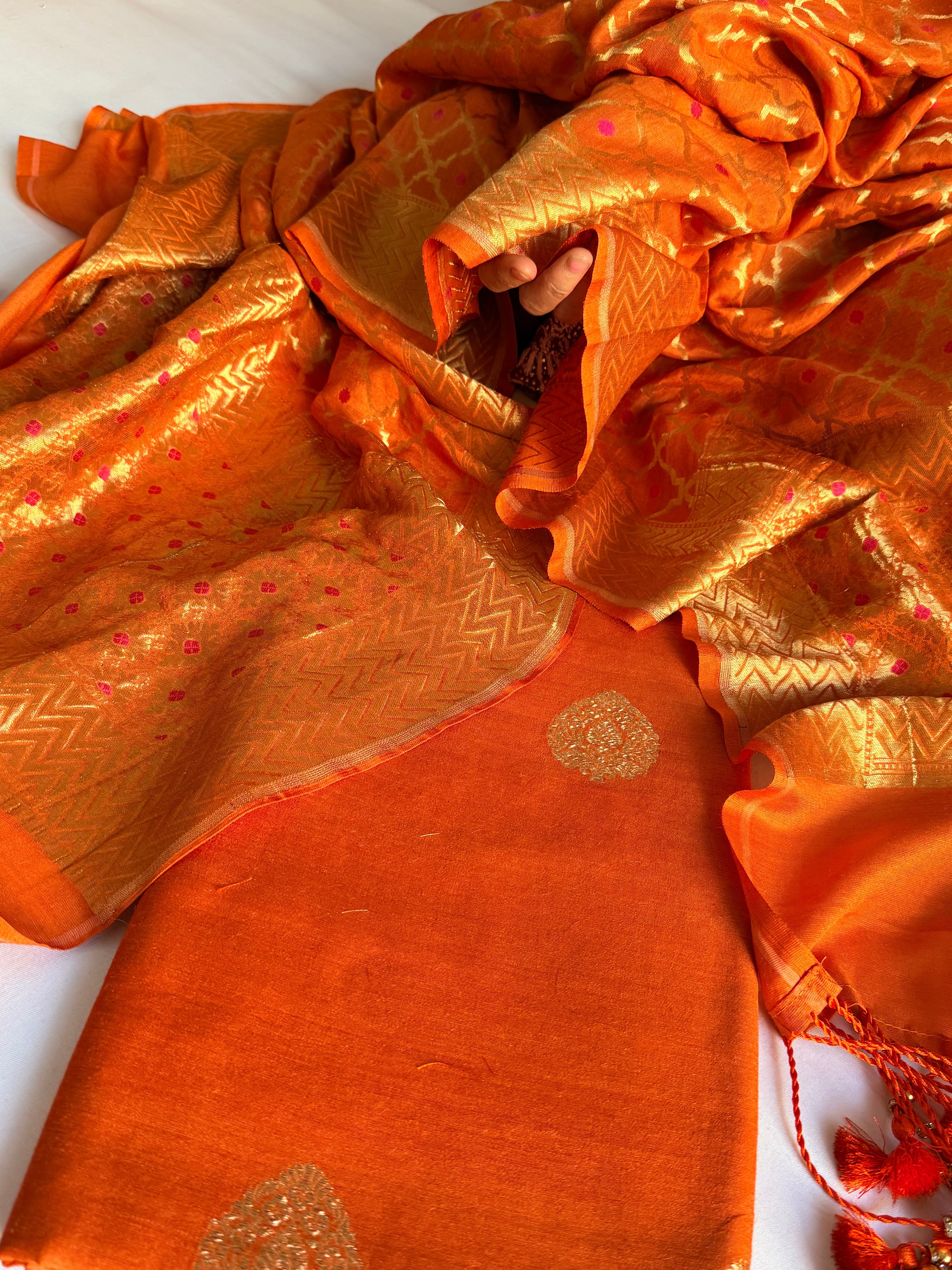 Moonga silk kadhwa kurta paired with gorgette duppata with latkans