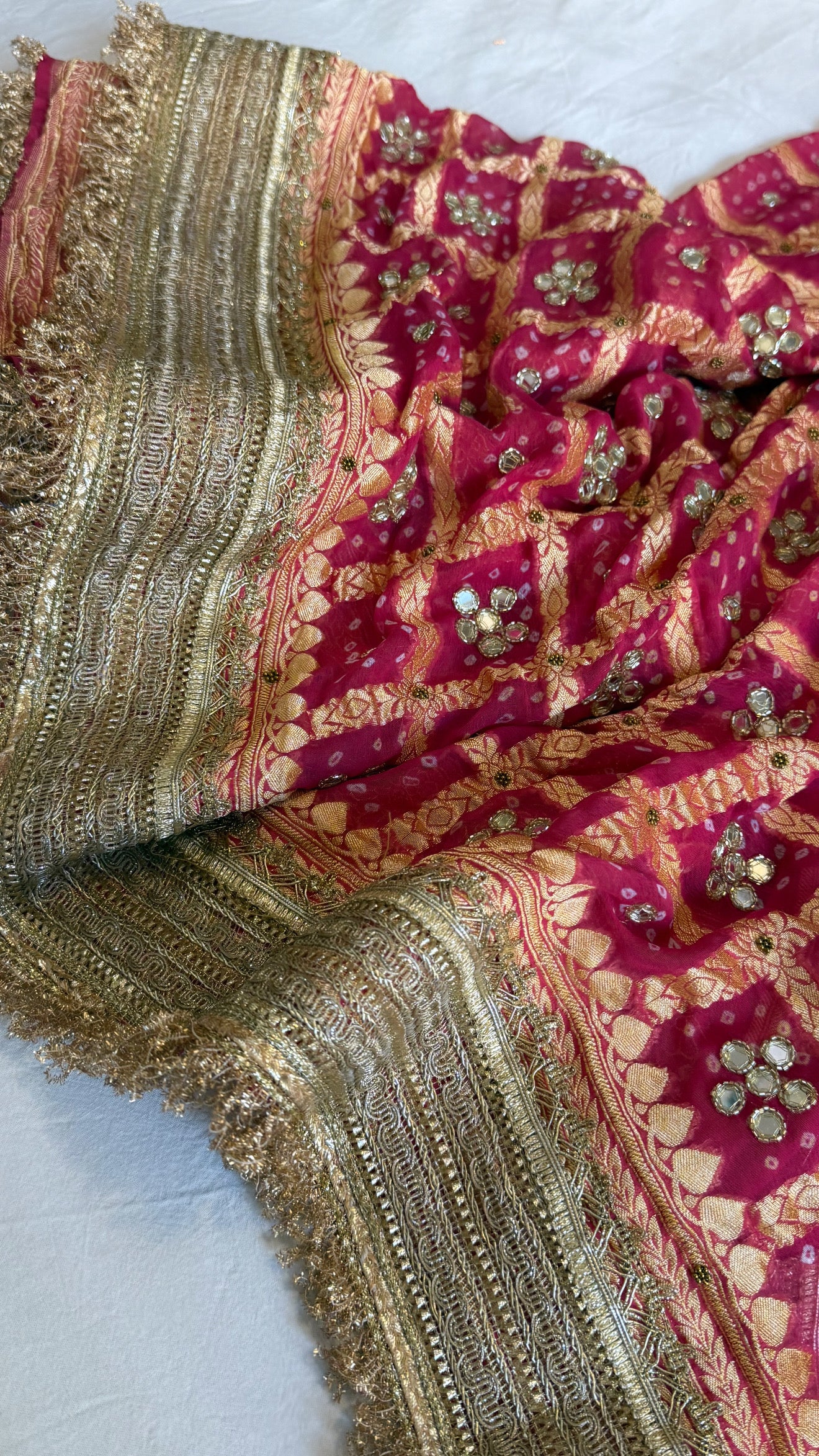 Cherry pink rai bandhej mirror work banarasi gorgette saree with long latkans