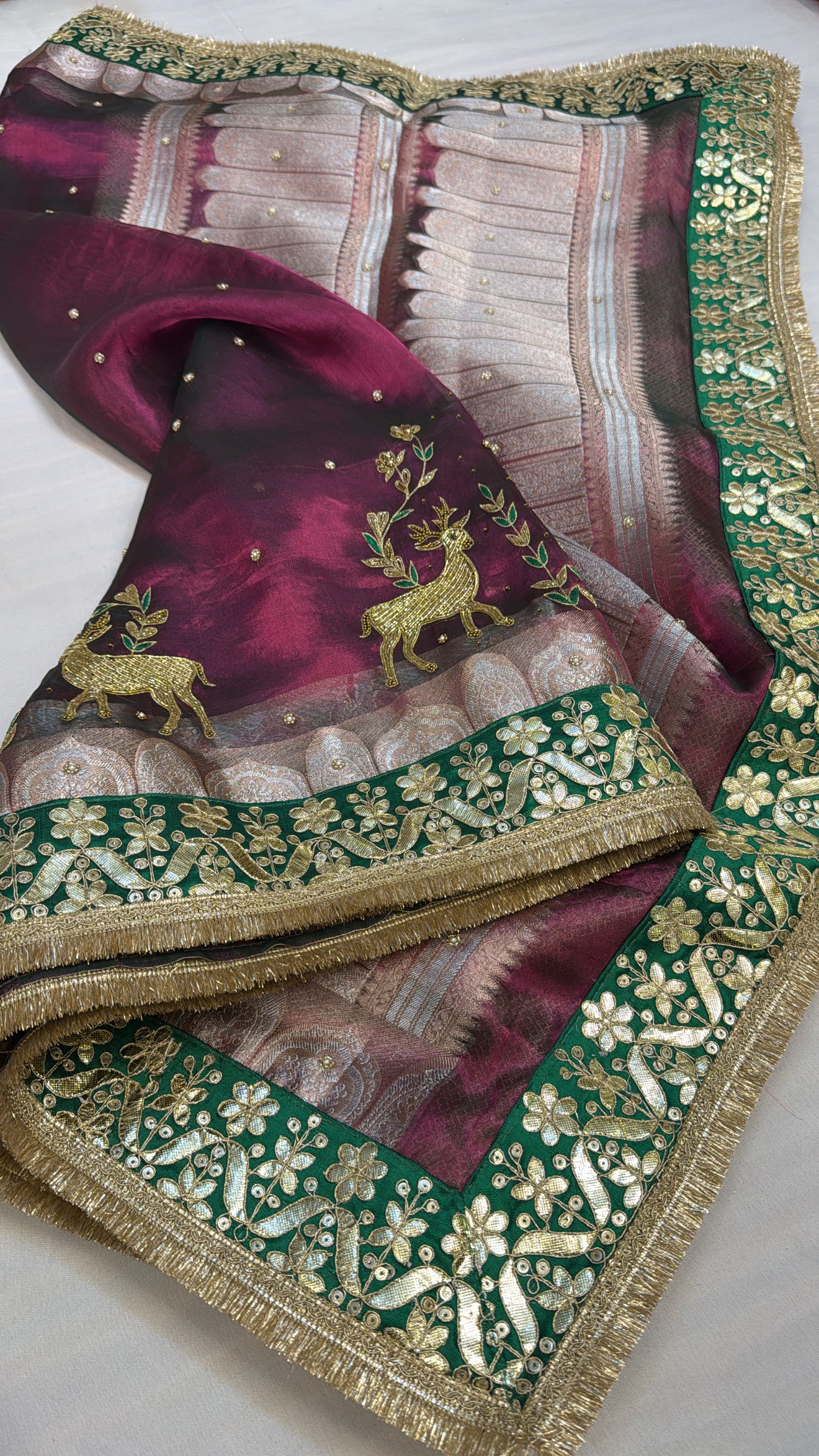 Husn cranberry pink tissue silk deer motif hand embroidered saree
