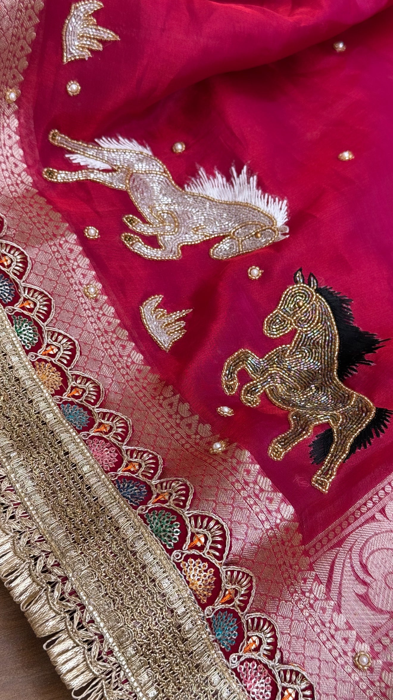 Horse hand embroidered motif cherry pinkish red dhup chao effect tissue silk banarasi gotapatti kadhwa saree