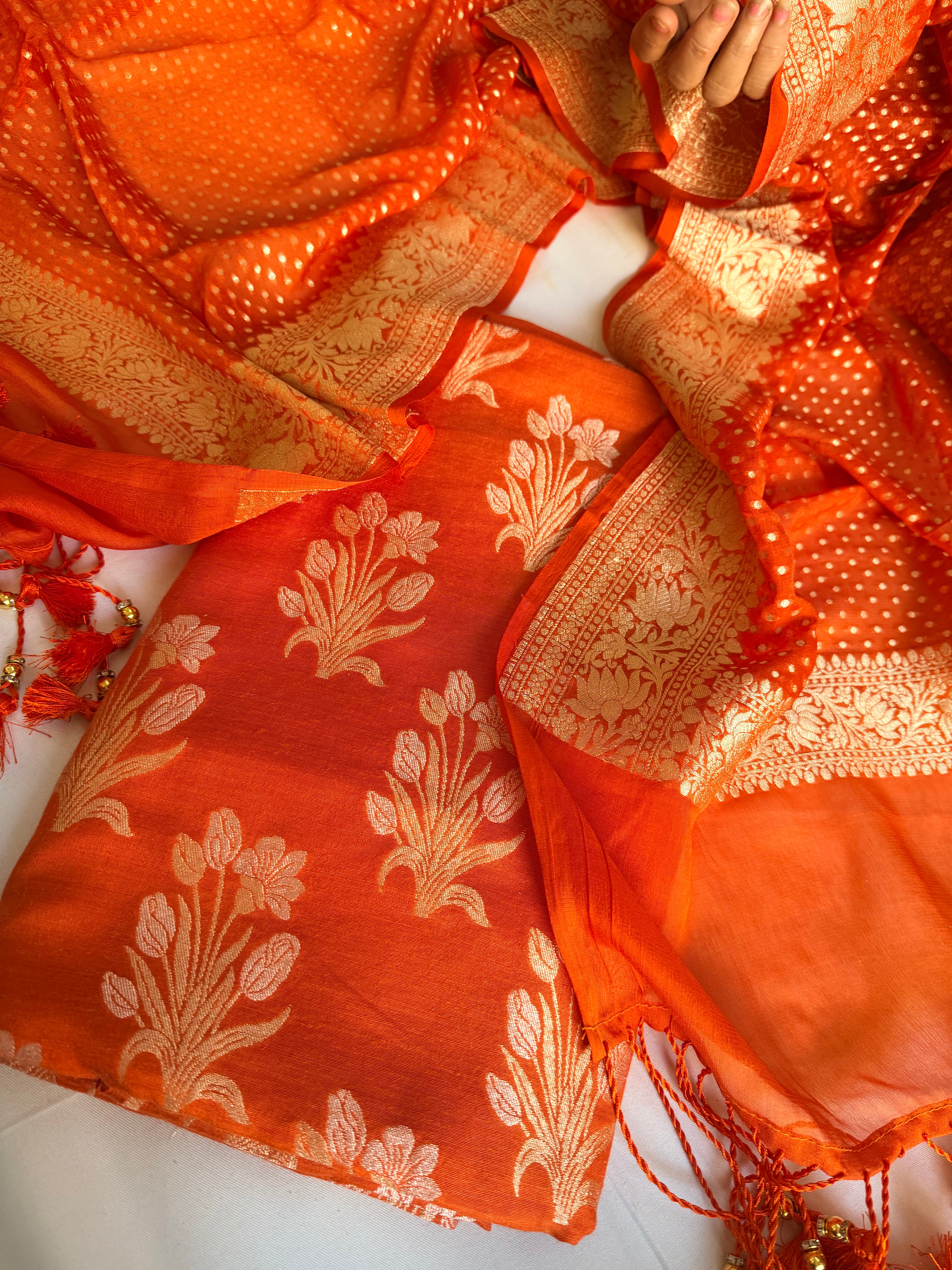 Moonga silk kadhwa kurta paired with gorgette duppata with latkans