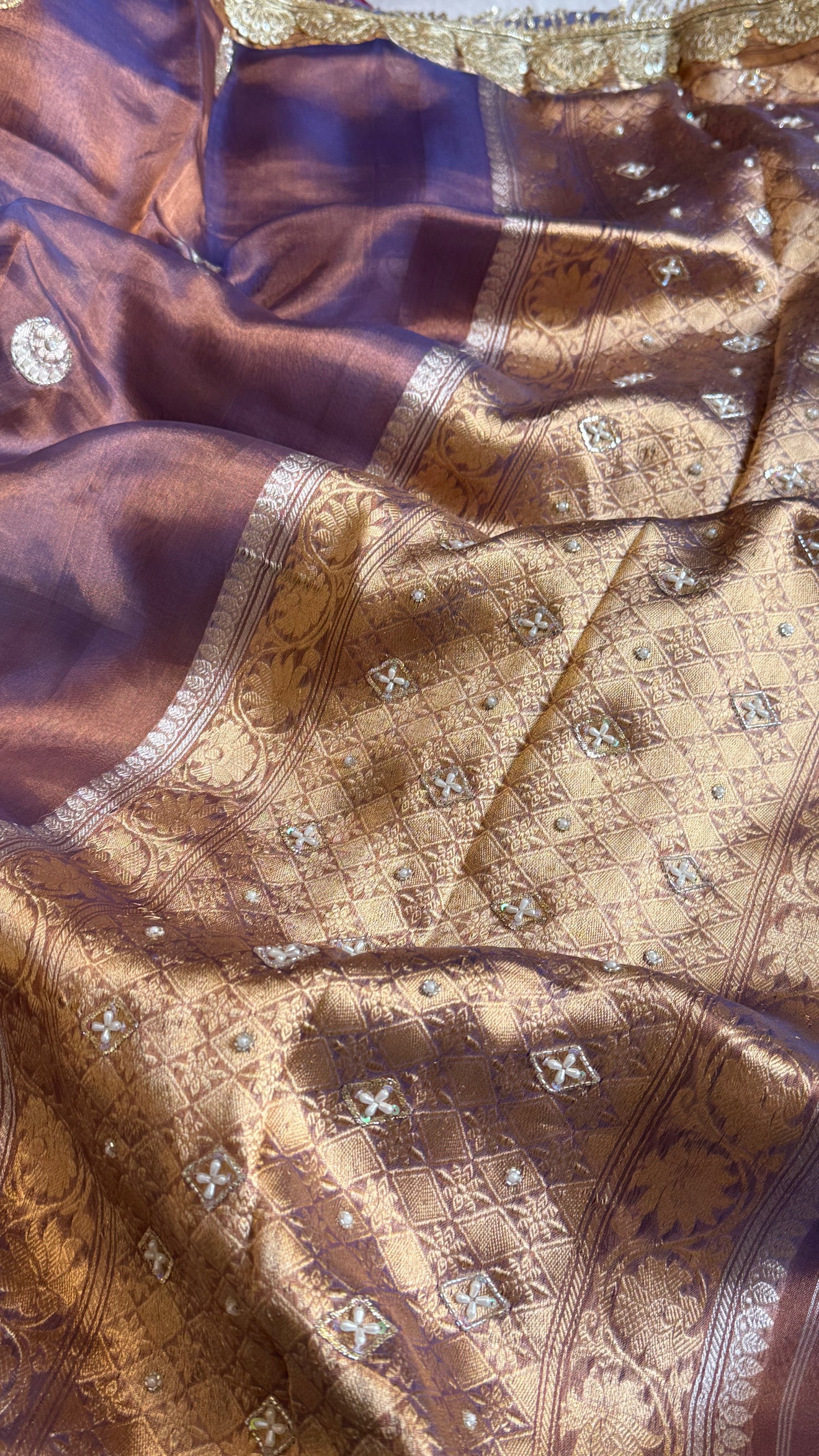 Chand tara copperish blue dhup chao effect tissue silk hand embroidered saree