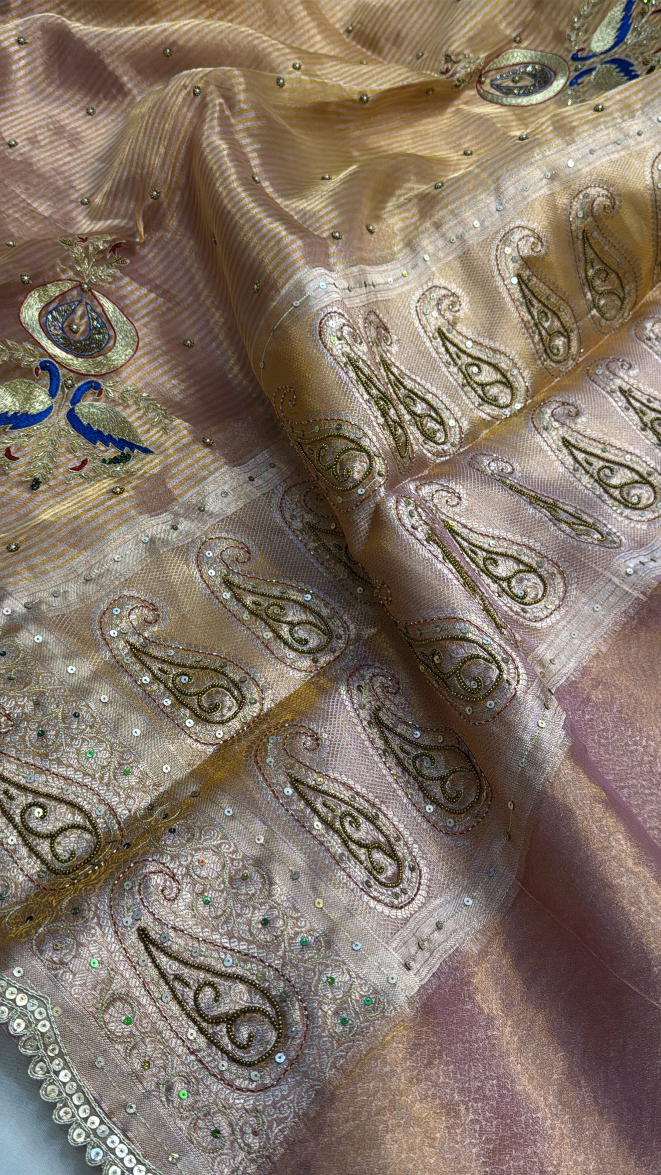 Peachish-pink ombre shaded tissue silk hand embroidered saree