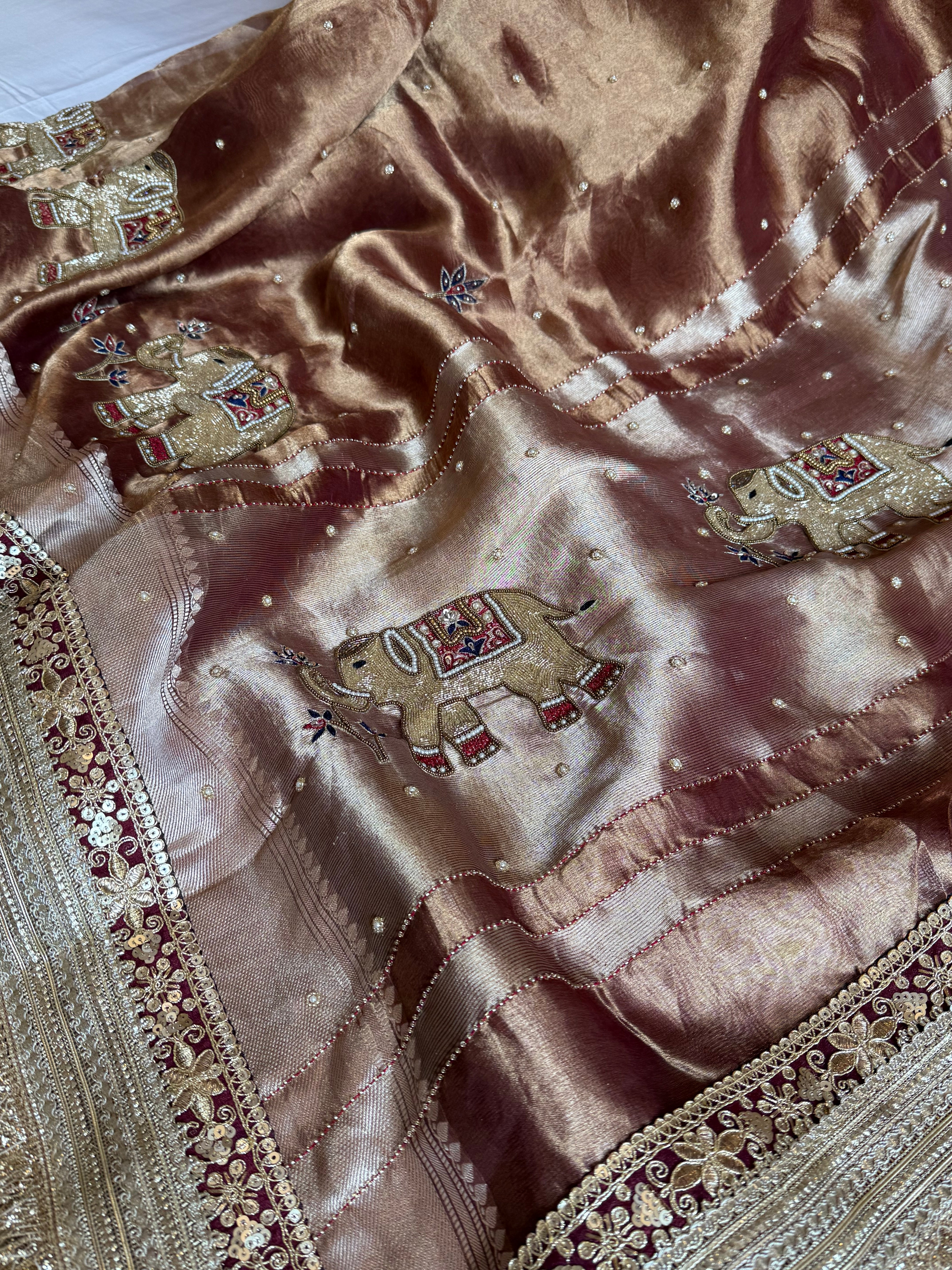 Elephant motif brown tissue silk hand embroidered husn saree