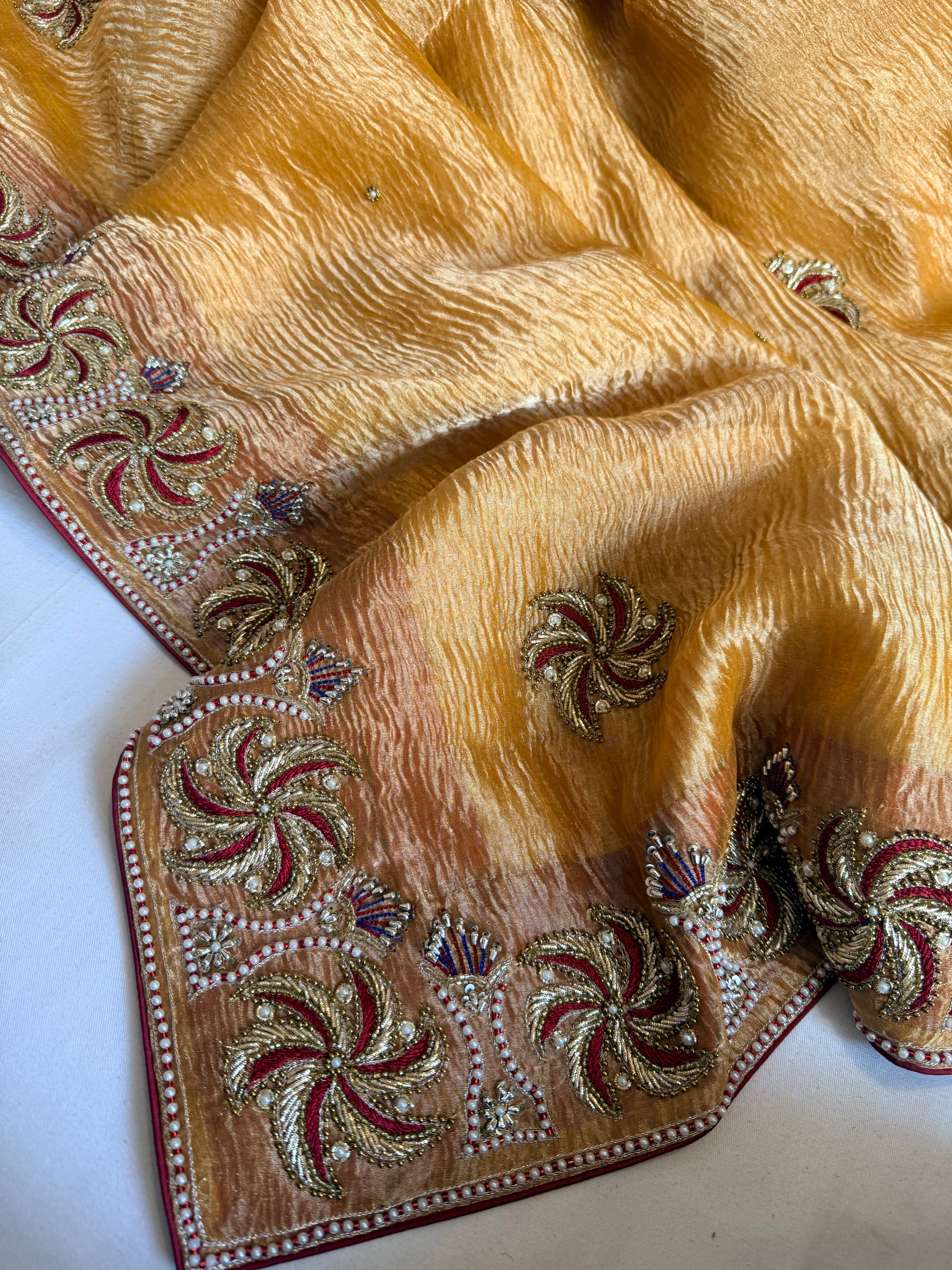 Rajkumari kesari yellow crushed tissue silk zardozi work hand embroidered saree